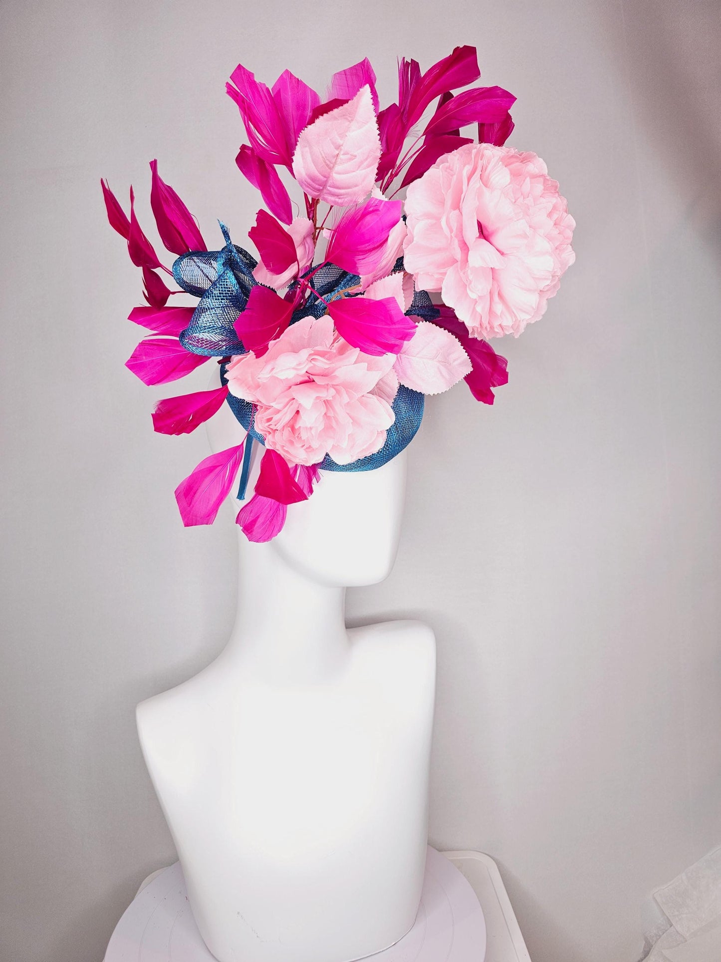 kentucky derby hat fascinator blue sinamay with bow and light pink peony satin flowers light pink leaves hot bright pink branching feathers