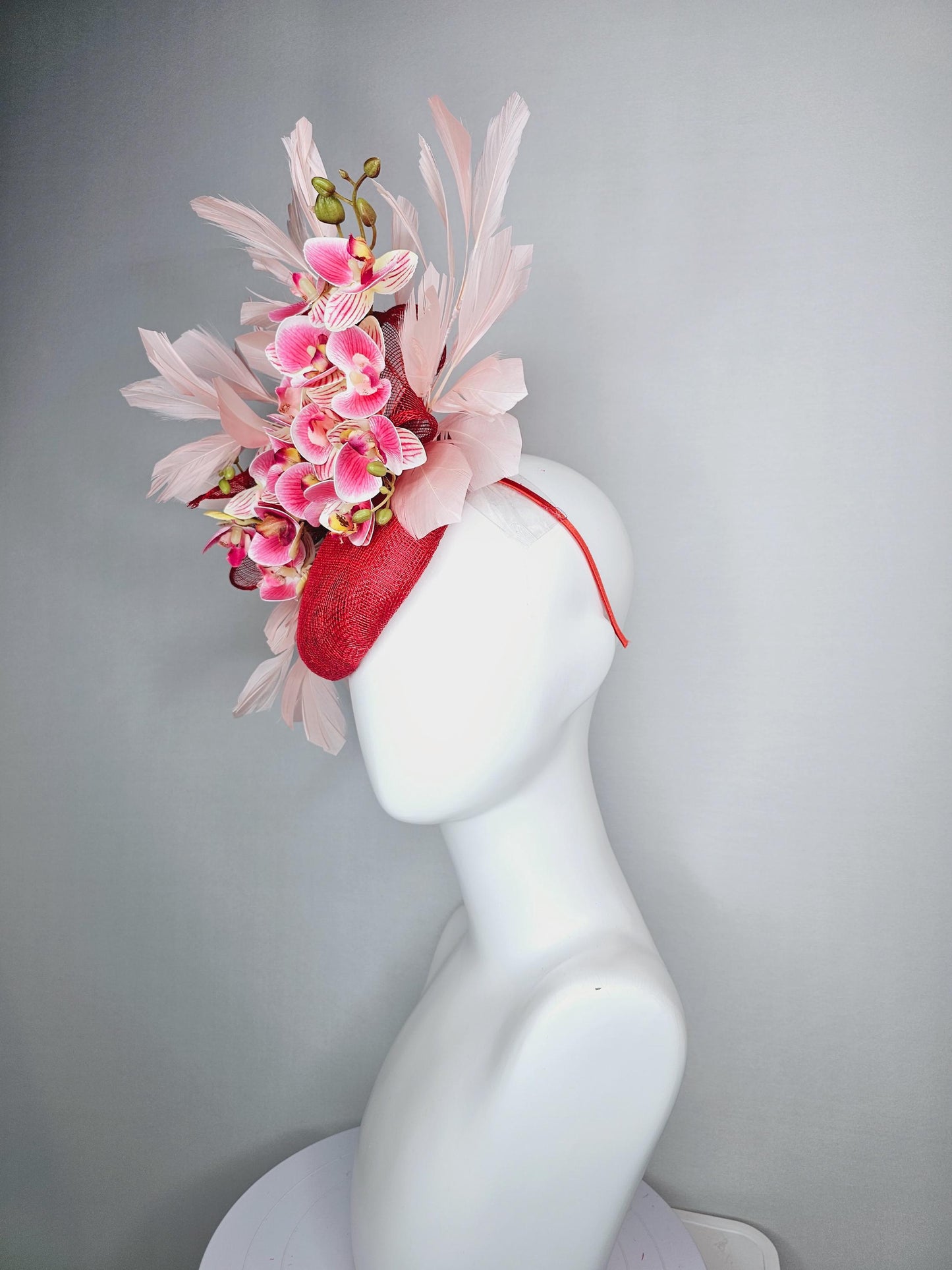 kentucky derby hat fascinator red sinamay with bow and white raspberry red pink satin orchid flowers with champagne pink branching feathers