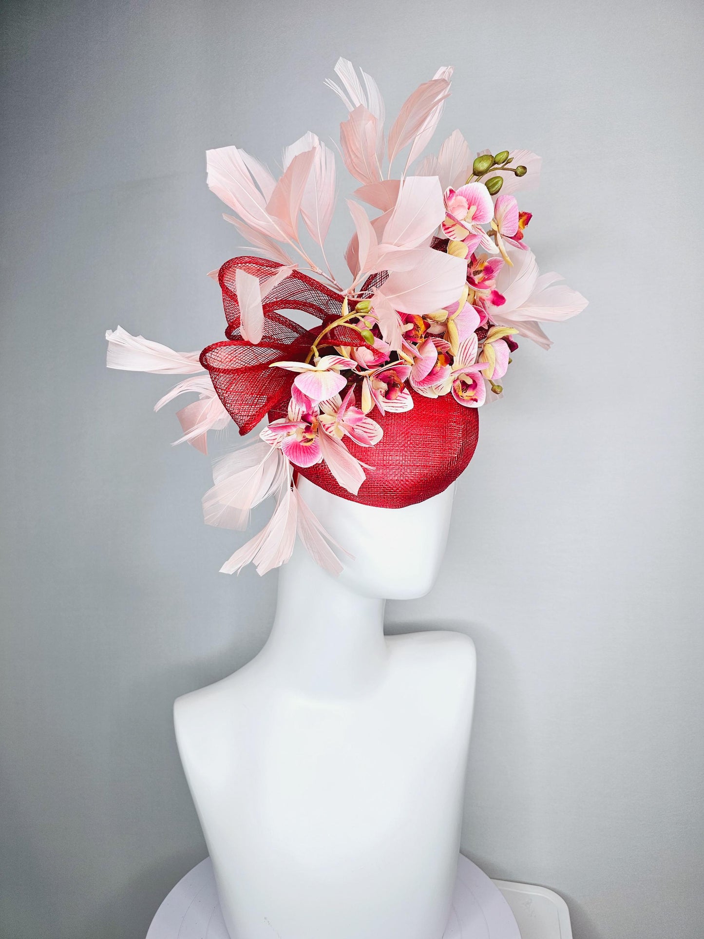 kentucky derby hat fascinator red sinamay with bow and white raspberry red pink satin orchid flowers with champagne pink branching feathers