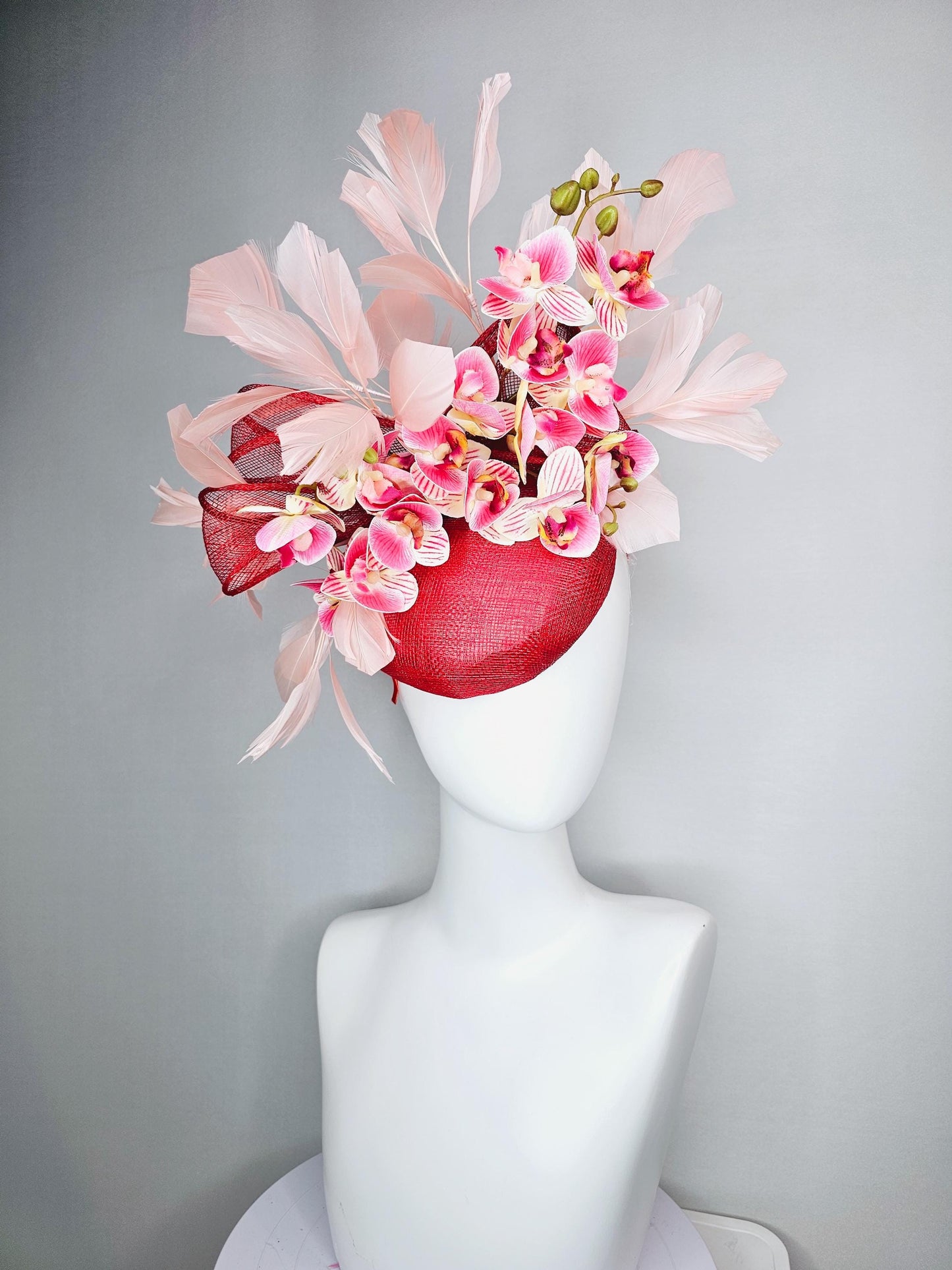kentucky derby hat fascinator red sinamay with bow and white raspberry red pink satin orchid flowers with champagne pink branching feathers