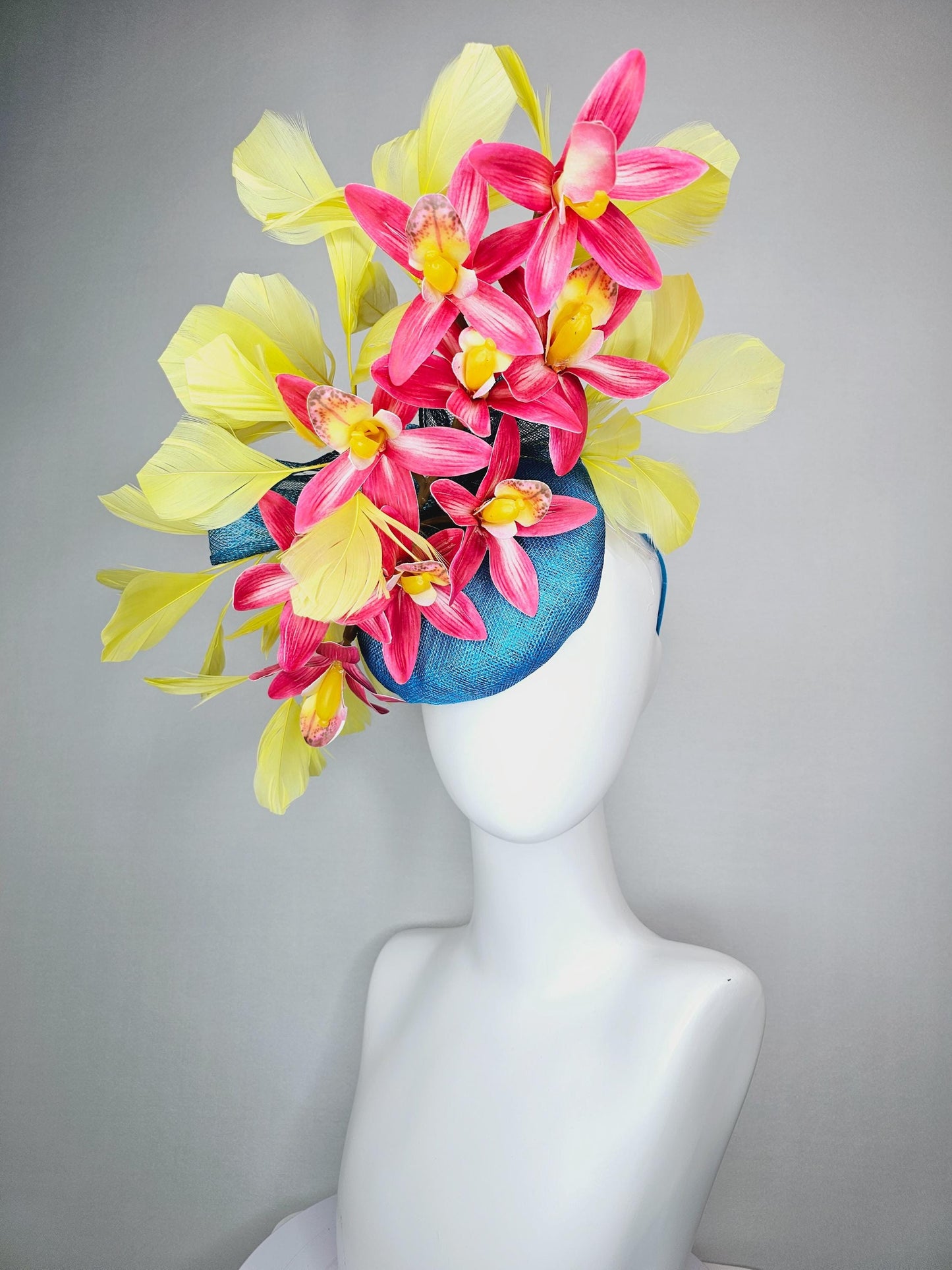 kentucky derby hat fascinator turquoise blue sinamay with bow and raspberry red satin orchid flowers with yellow branching feathers