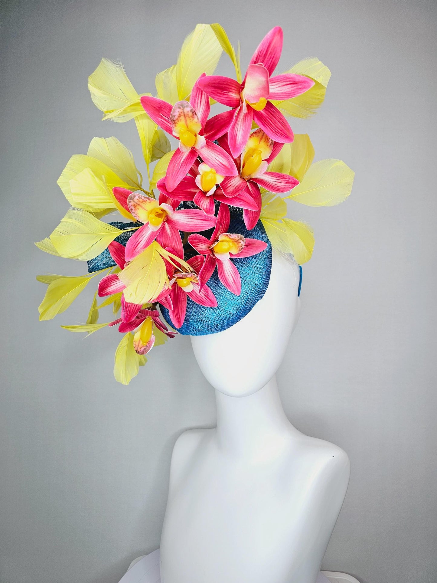 kentucky derby hat fascinator turquoise blue sinamay with bow and raspberry red satin orchid flowers with yellow branching feathers
