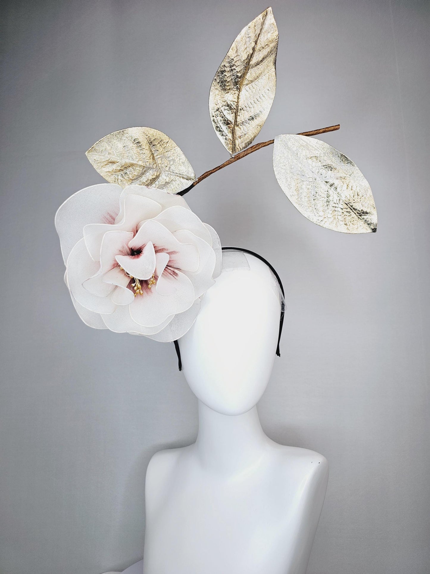 kentucky derby hat fascinator headband with large ivory white wire mesh flower on stem with large gold leaves