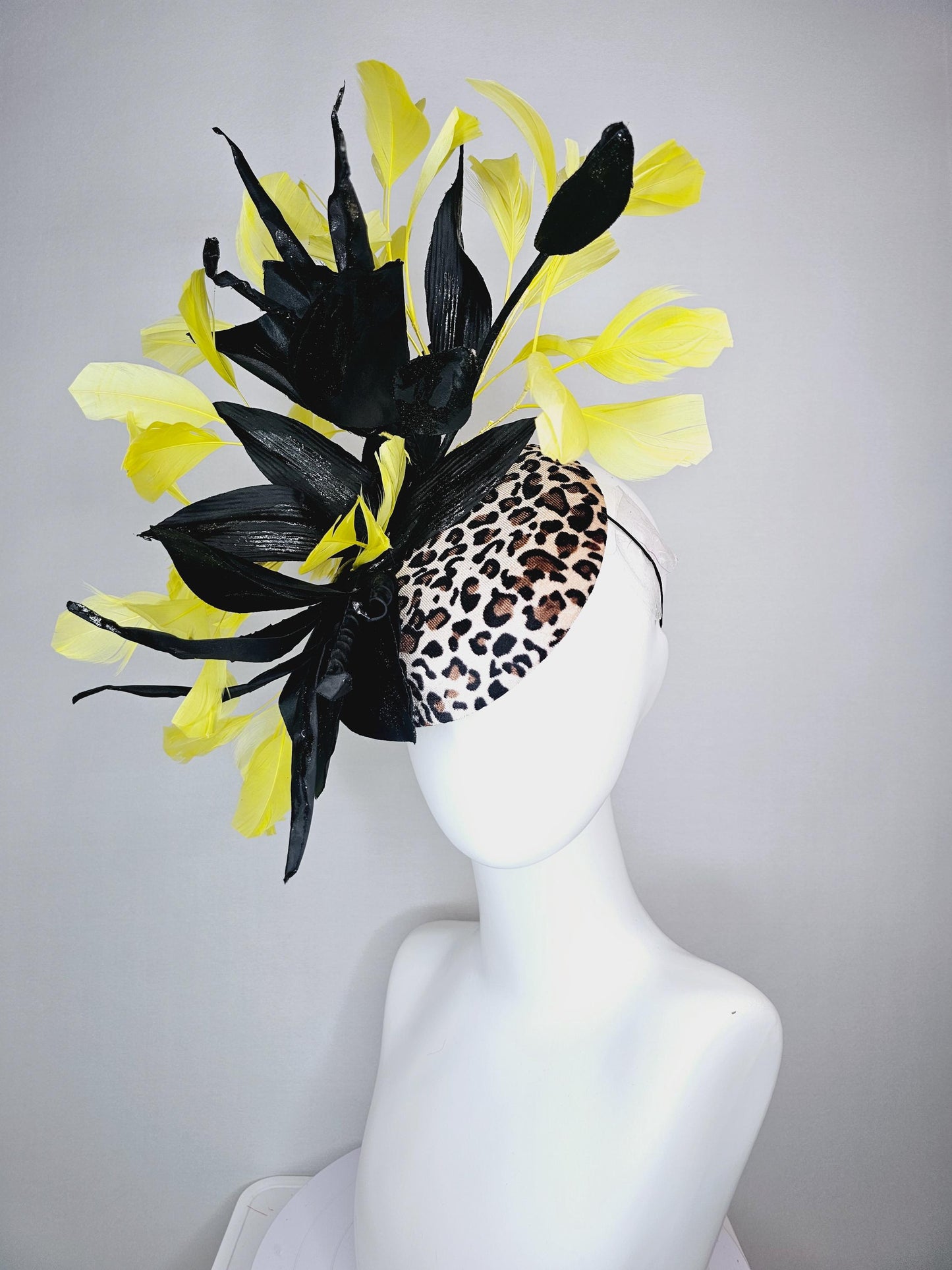 kentucky derby hat fascinator velvet leopard print with black satin flowers and satin black leaves with yellow branching feathers