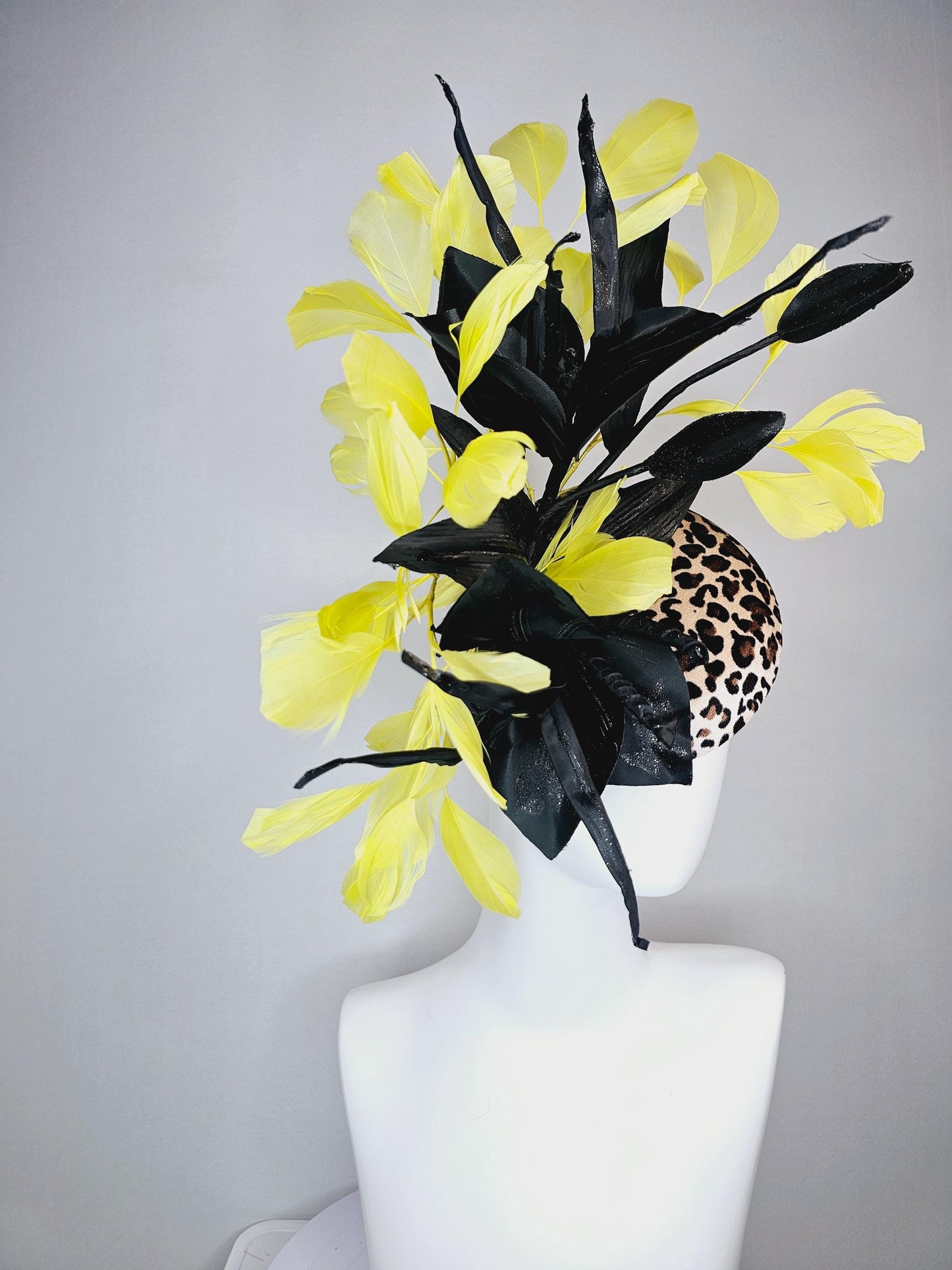 kentucky derby hat fascinator velvet leopard print with black satin flowers and satin black leaves with yellow branching feathers
