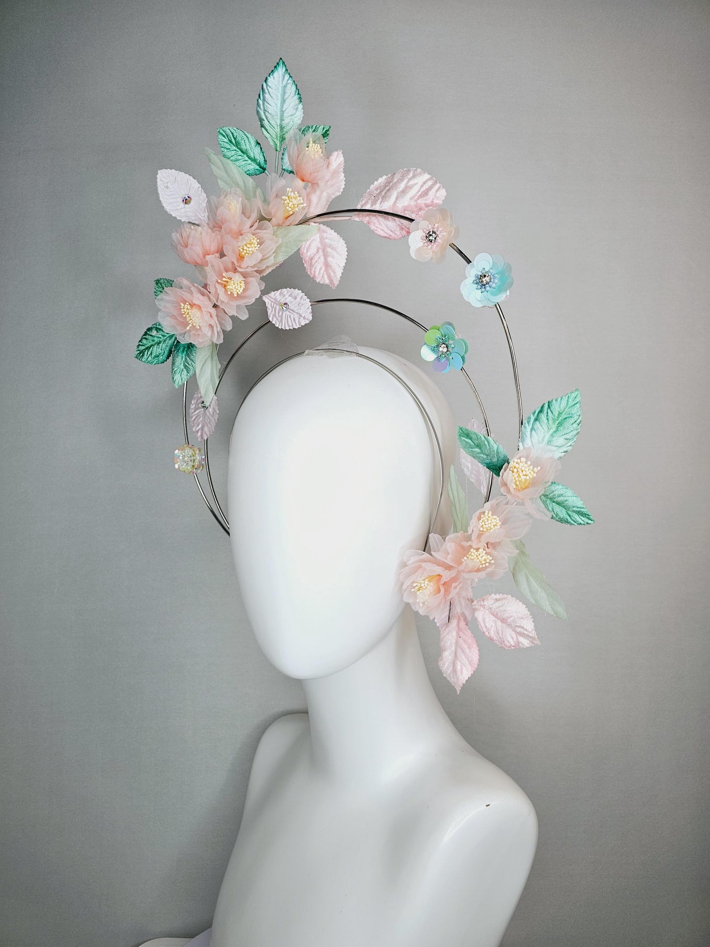 kentucky derby hat fascinator light pink organza flowers baby pink white mint green leaves on tiered silver metallic headband sequin flower