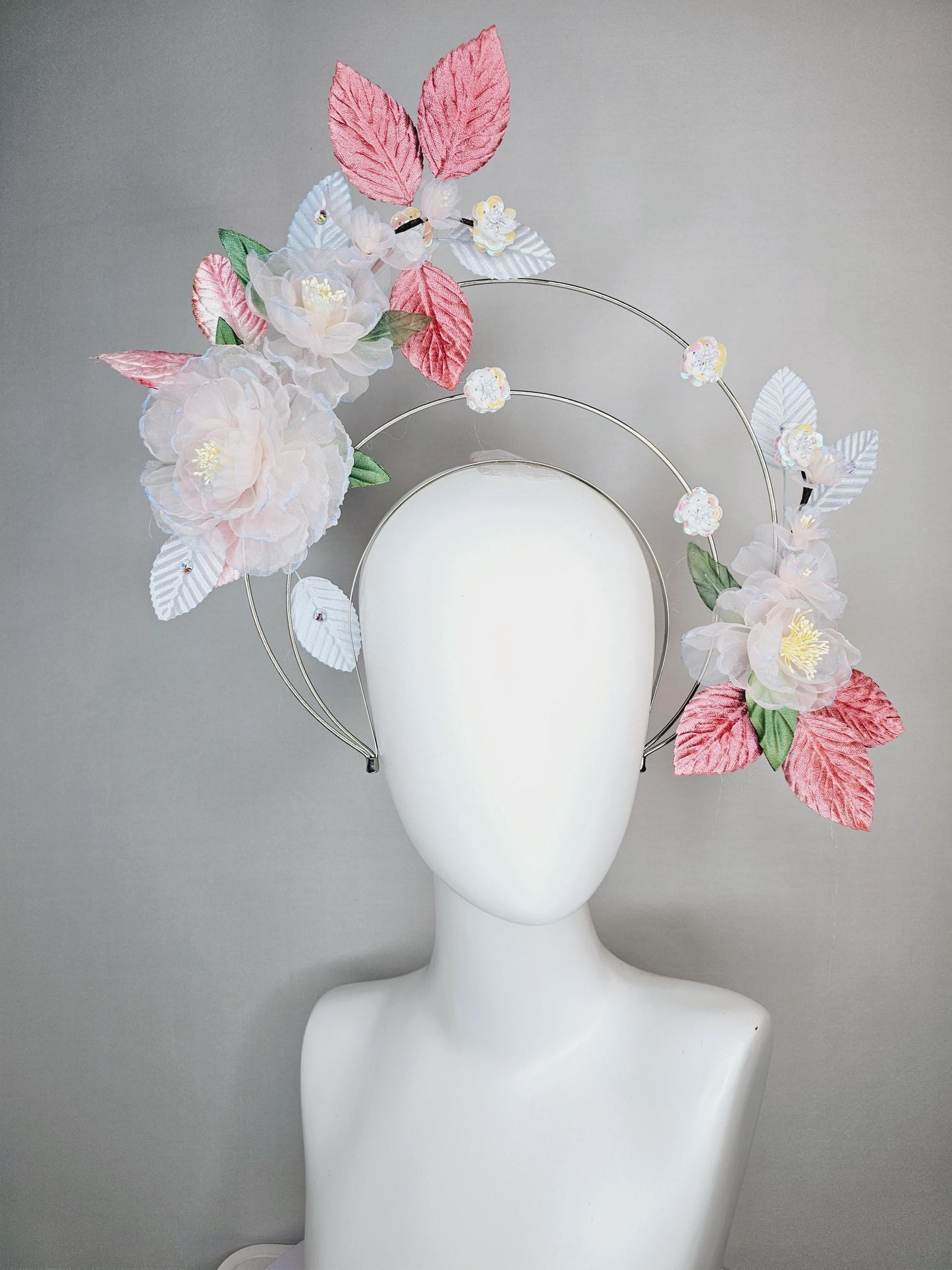 kentucky derby hat fascinator light pink and blue organza flowers dusty pink green leaves on tiered silver metallic headband sequin flower