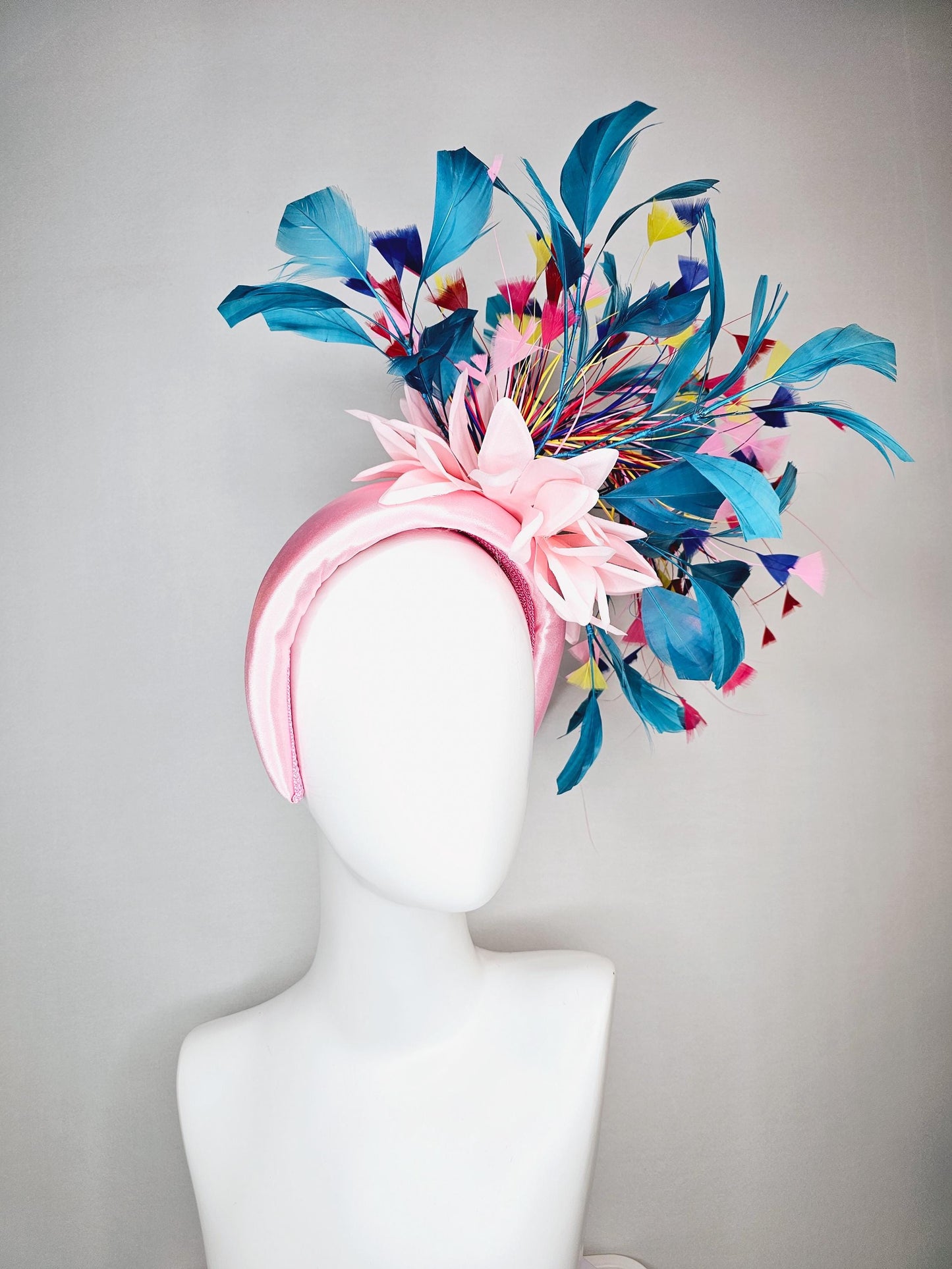 kentucky derby hat fascinator light pink satin headband with satin flower colorful teal royal blue baby pink yellow red branching feathers