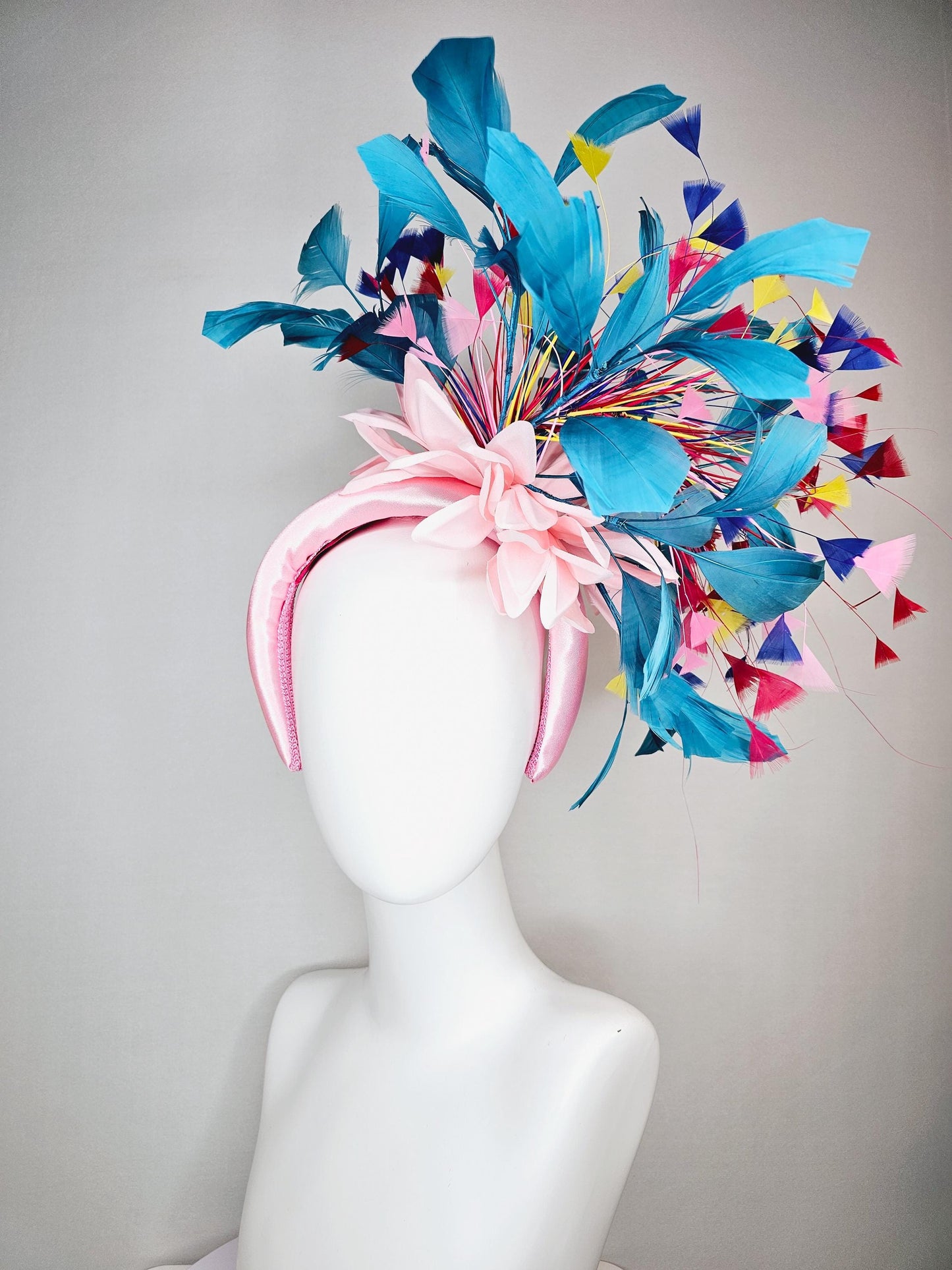 kentucky derby hat fascinator light pink satin headband with satin flower colorful teal royal blue baby pink yellow red branching feathers