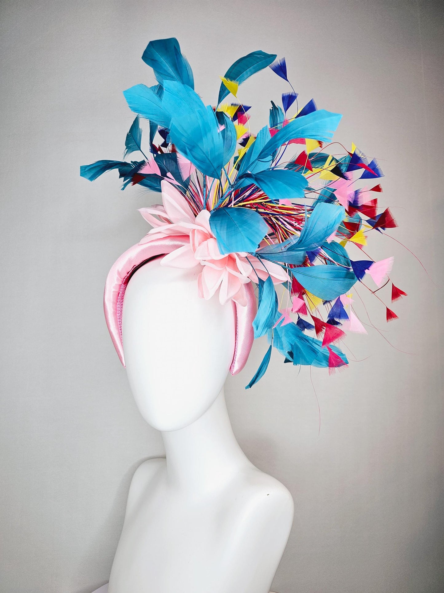 kentucky derby hat fascinator light pink satin headband with satin flower colorful teal royal blue baby pink yellow red branching feathers