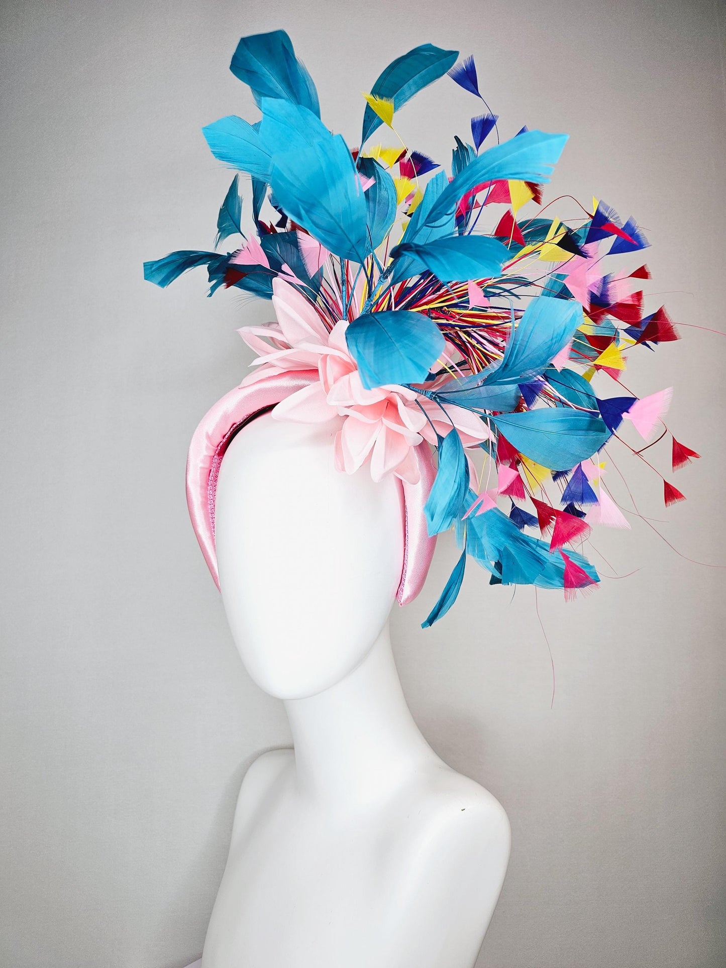kentucky derby hat fascinator light pink satin headband with satin flower colorful teal royal blue baby pink yellow red branching feathers