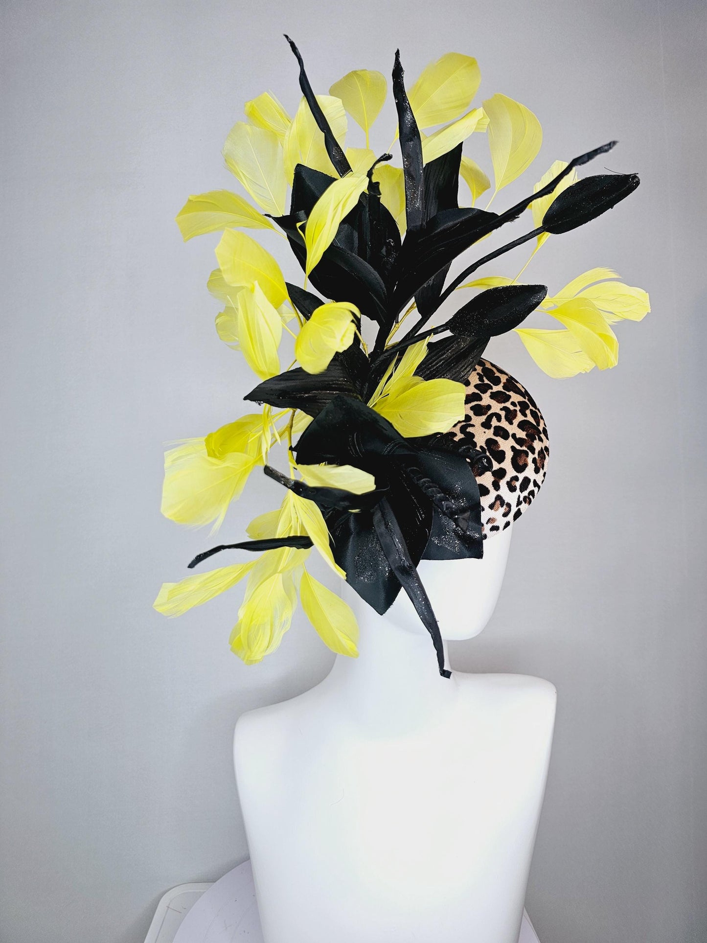 kentucky derby hat fascinator velvet leopard print with black satin flowers and satin black leaves with yellow branching feathers