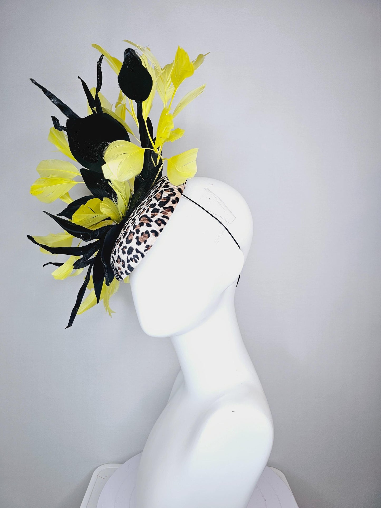 kentucky derby hat fascinator velvet leopard print with black satin flowers and satin black leaves with yellow branching feathers