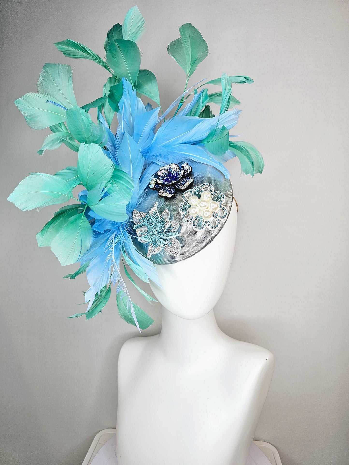 kentucky derby hat fascinator silver metallic with light royal cobalt blue iridescent crystal and pearl flowers mint green sky blue feathers