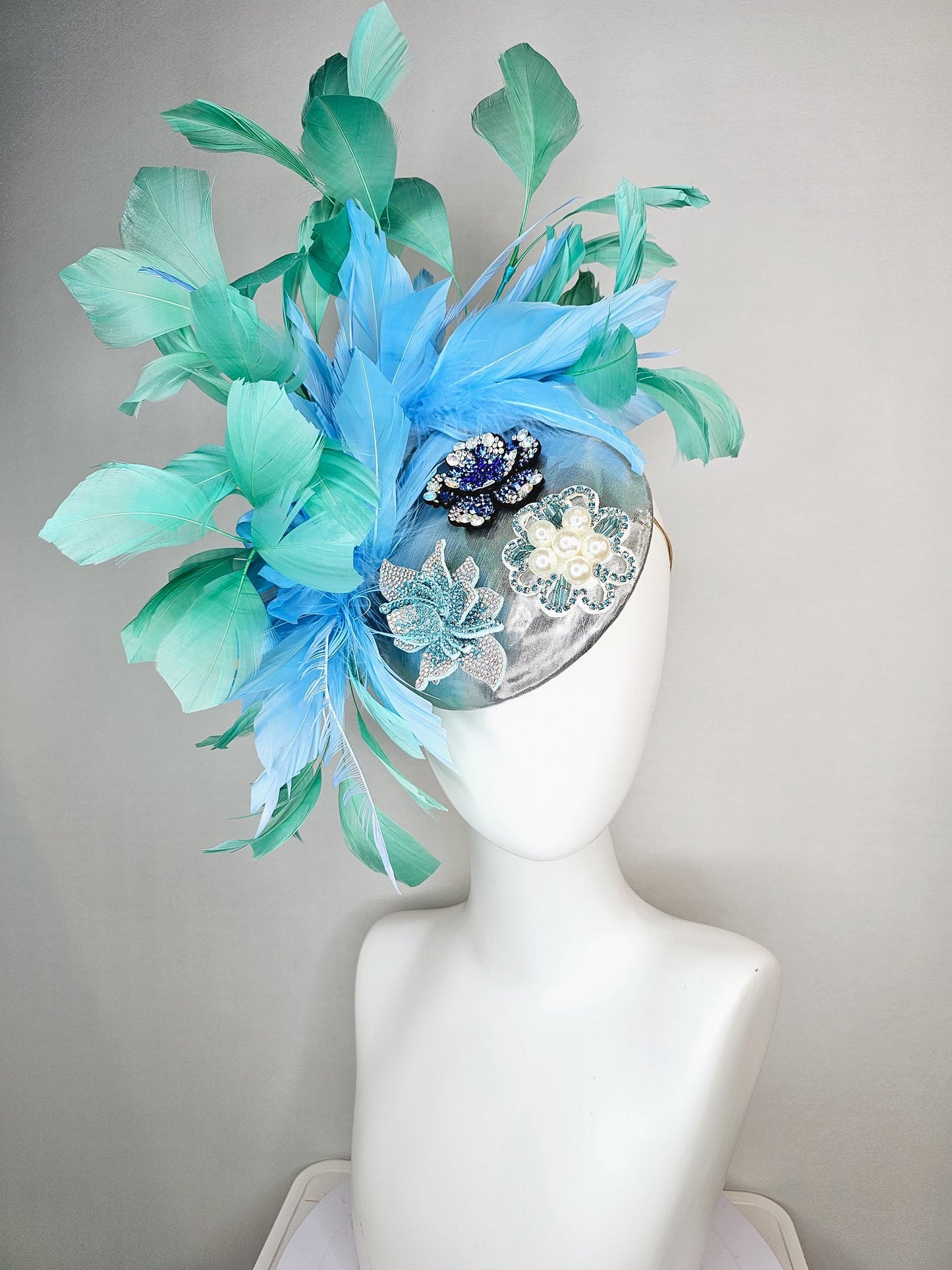 kentucky derby hat fascinator silver metallic with light royal cobalt blue iridescent crystal and pearl flowers mint green sky blue feathers