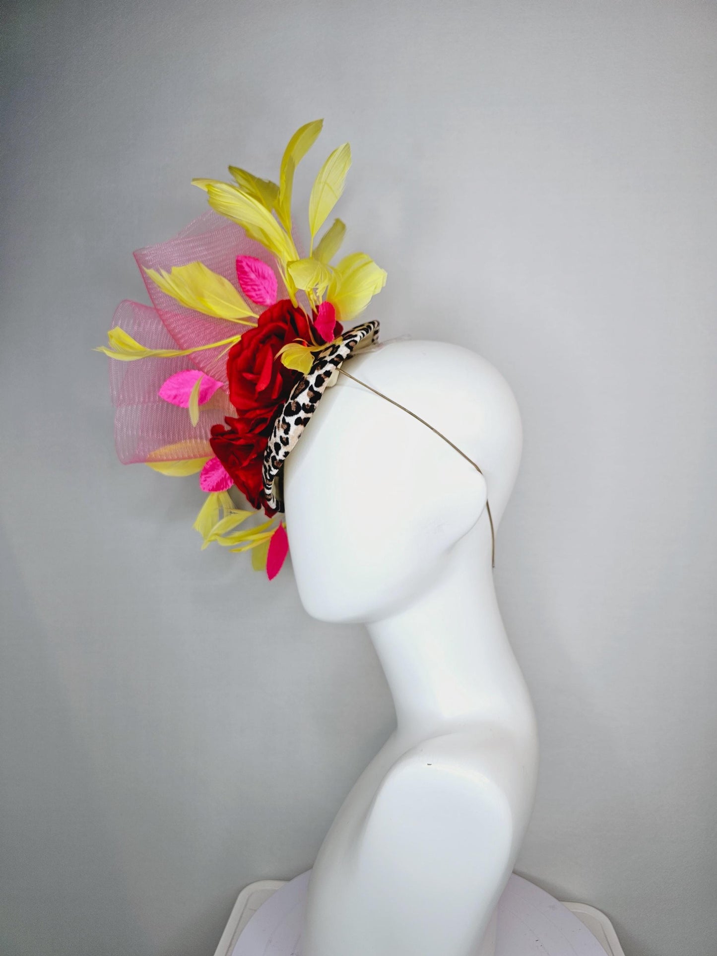 kentucky derby hat fascinator velvet leopard print base with red satin roses pink crinoline ruffle pink leaves and yellow branching feathers