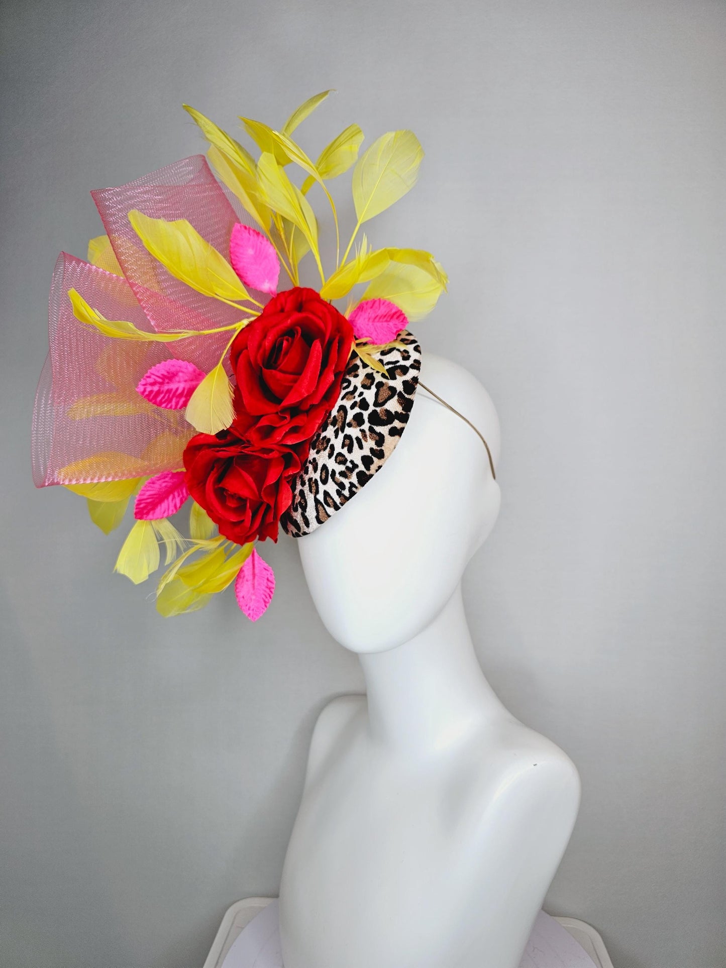 kentucky derby hat fascinator velvet leopard print base with red satin roses pink crinoline ruffle pink leaves and yellow branching feathers