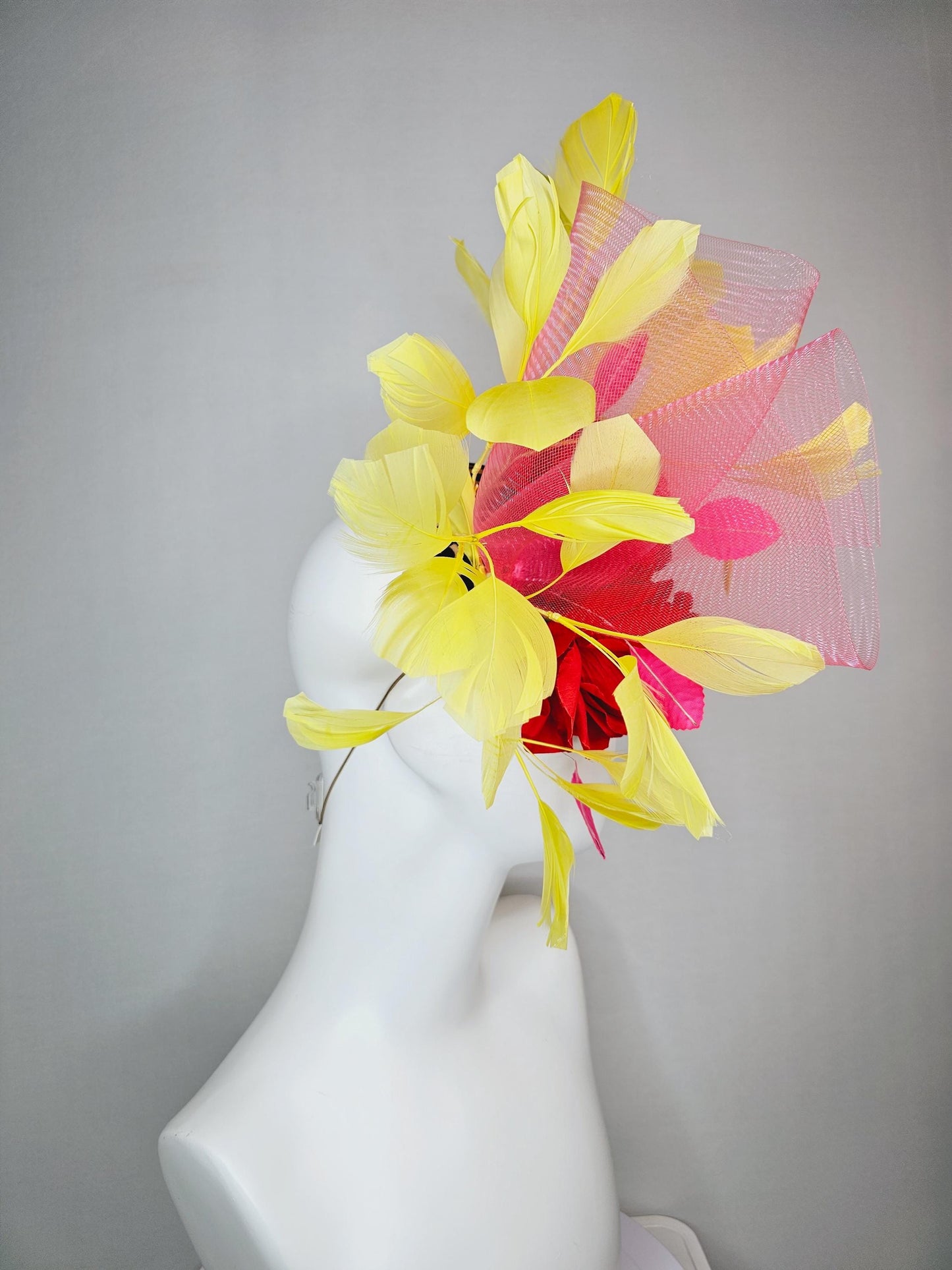 kentucky derby hat fascinator velvet leopard print base with red satin roses pink crinoline ruffle pink leaves and yellow branching feathers