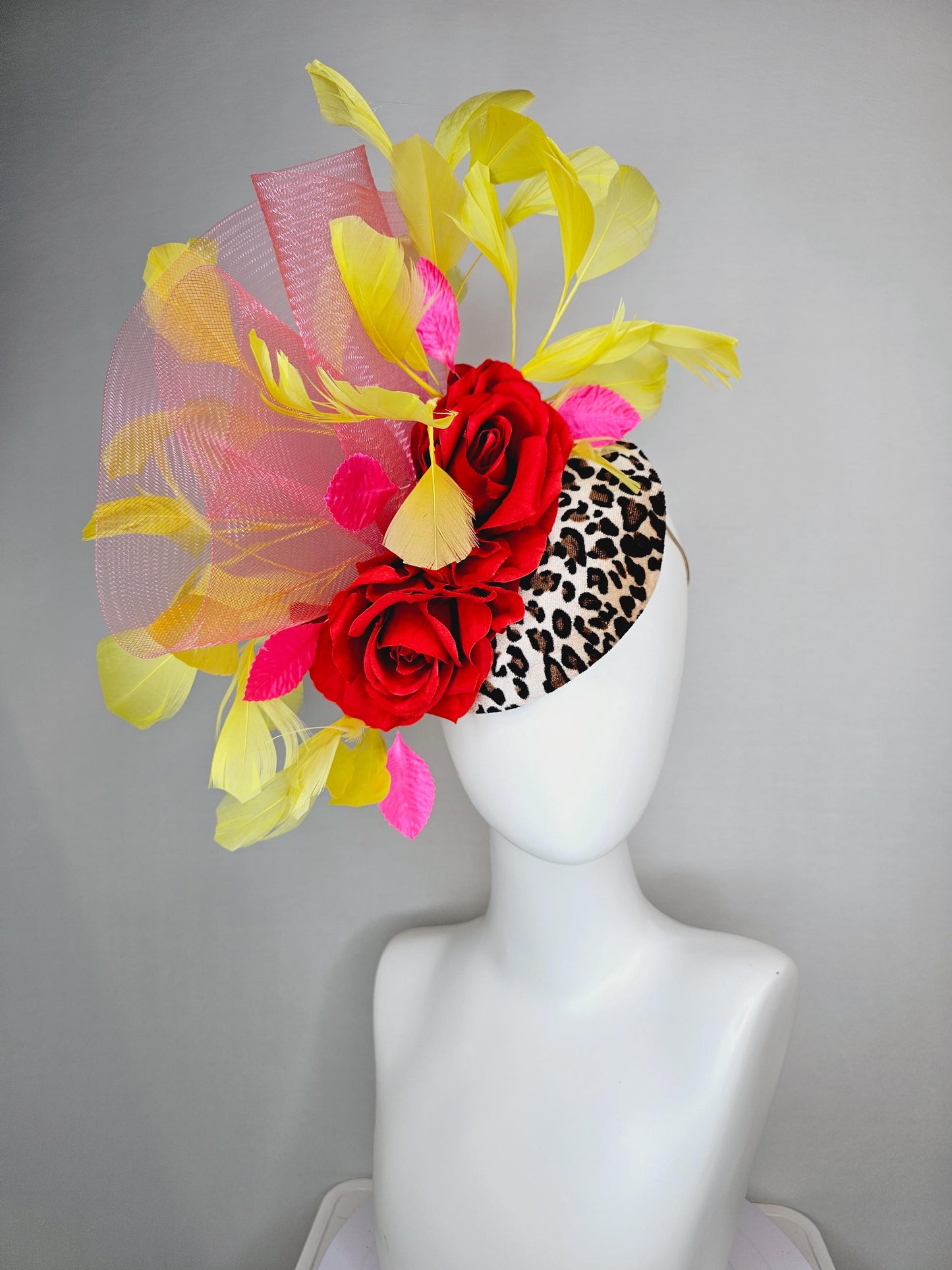 kentucky derby hat fascinator velvet leopard print base with red satin roses pink crinoline ruffle pink leaves and yellow branching feathers