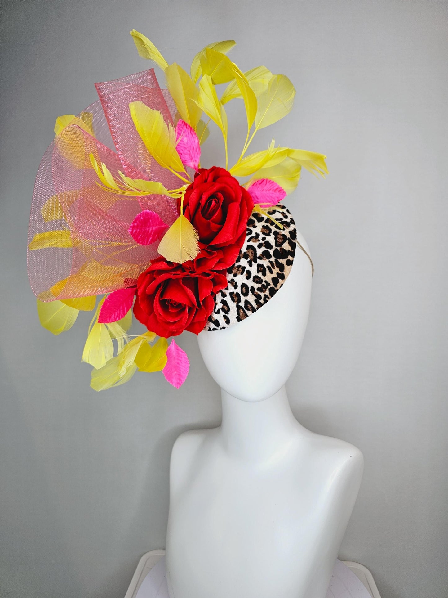 kentucky derby hat fascinator velvet leopard print base with red satin roses pink crinoline ruffle pink leaves and yellow branching feathers