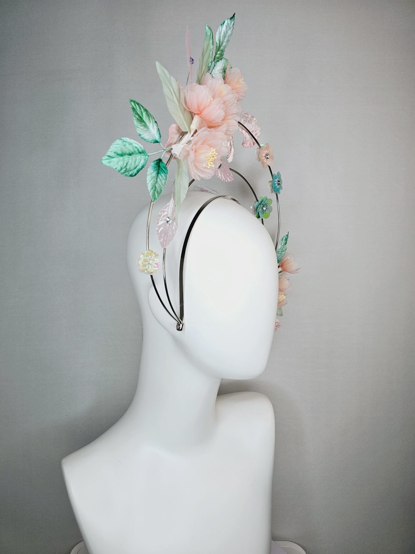 kentucky derby hat fascinator light pink organza flowers baby pink white mint green leaves on tiered silver metallic headband sequin flower