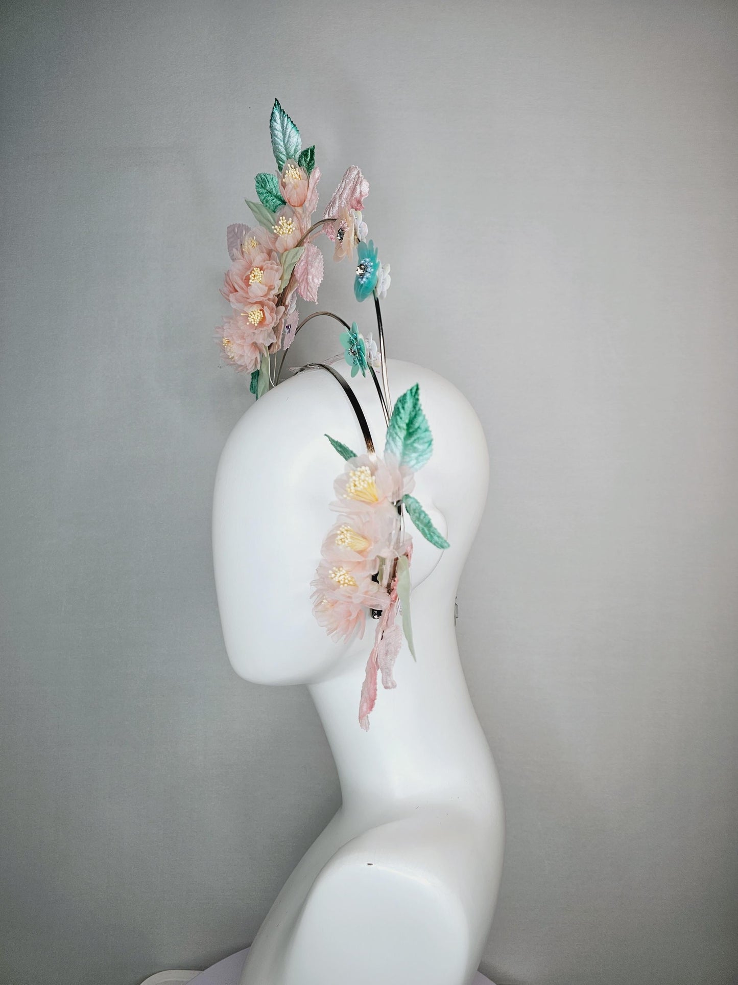 kentucky derby hat fascinator light pink organza flowers baby pink white mint green leaves on tiered silver metallic headband sequin flower
