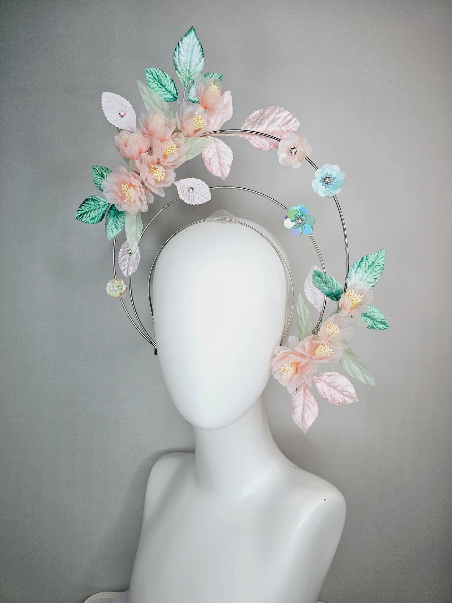 kentucky derby hat fascinator light pink organza flowers baby pink white mint green leaves on tiered silver metallic headband sequin flower