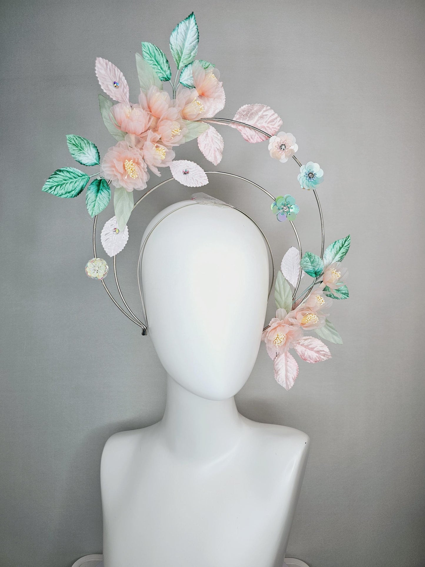 kentucky derby hat fascinator light pink organza flowers baby pink white mint green leaves on tiered silver metallic headband sequin flower