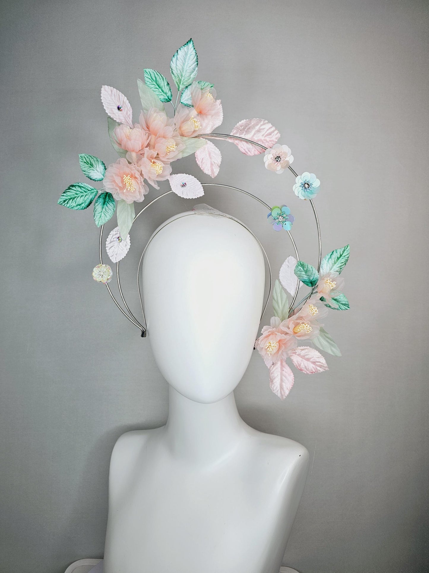 kentucky derby hat fascinator light pink organza flowers baby pink white mint green leaves on tiered silver metallic headband sequin flower