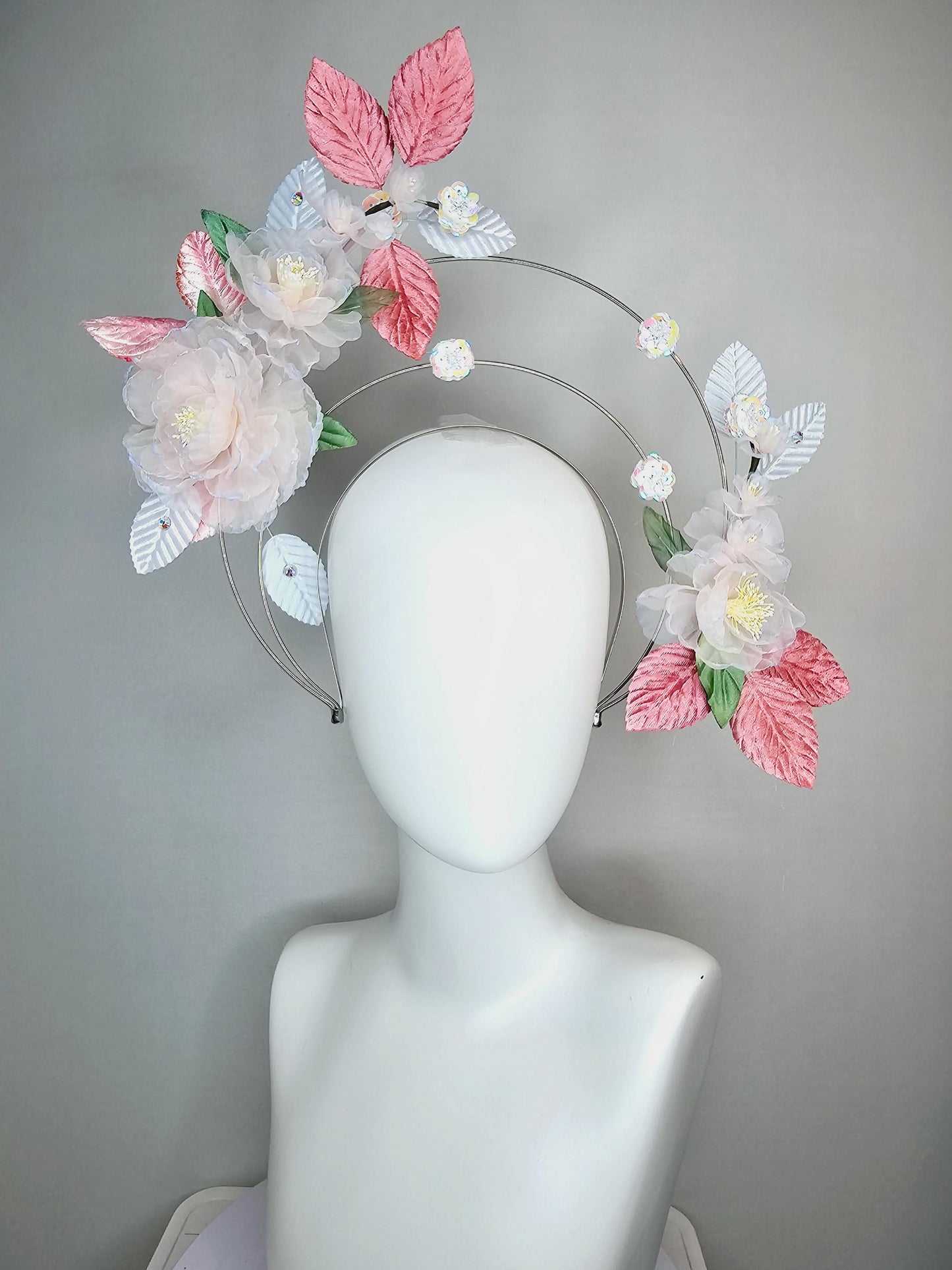 kentucky derby hat fascinator light pink and blue organza flowers dusty pink green leaves on tiered silver metallic headband sequin flower
