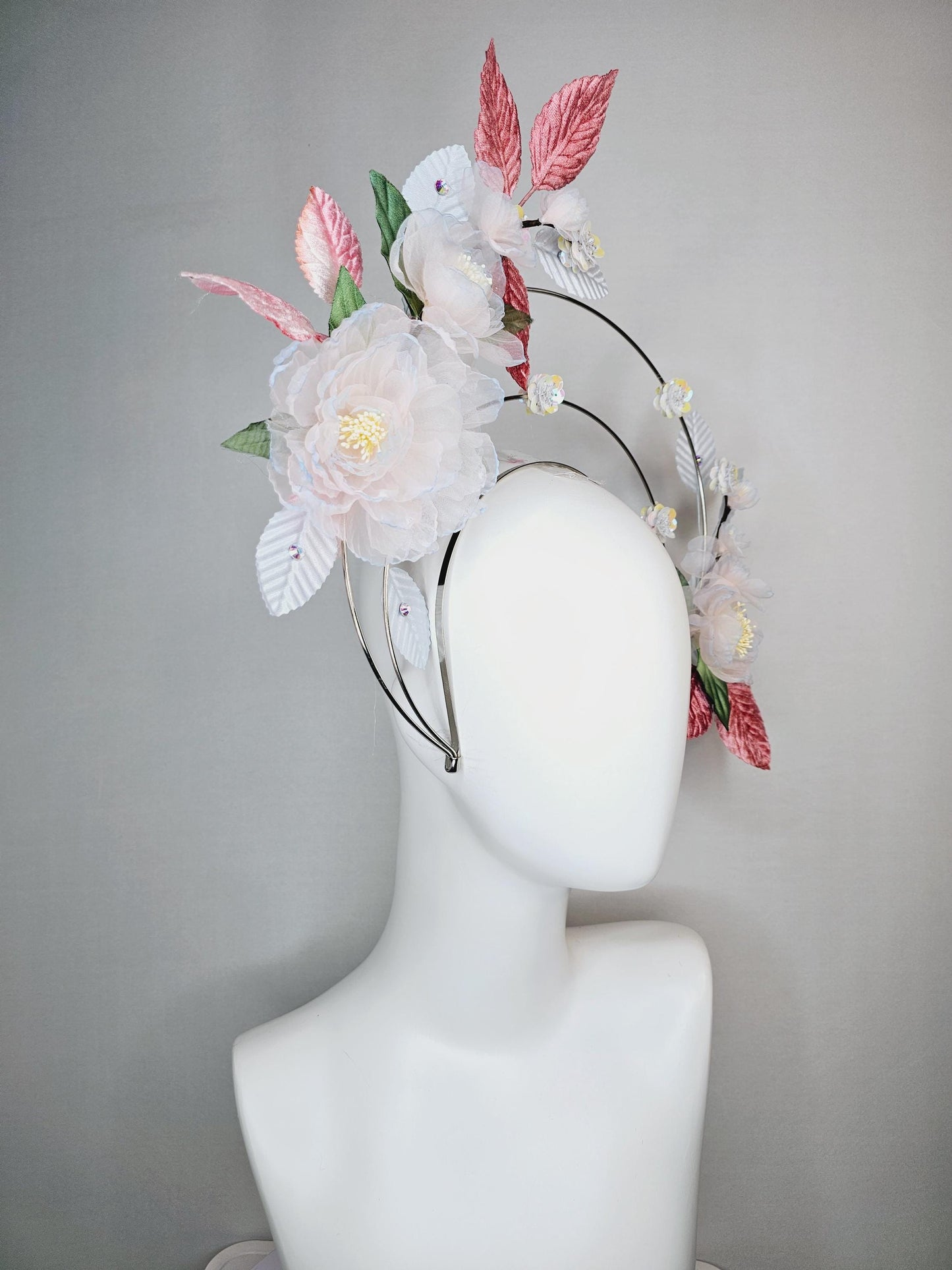 kentucky derby hat fascinator light pink and blue organza flowers dusty pink green leaves on tiered silver metallic headband sequin flower