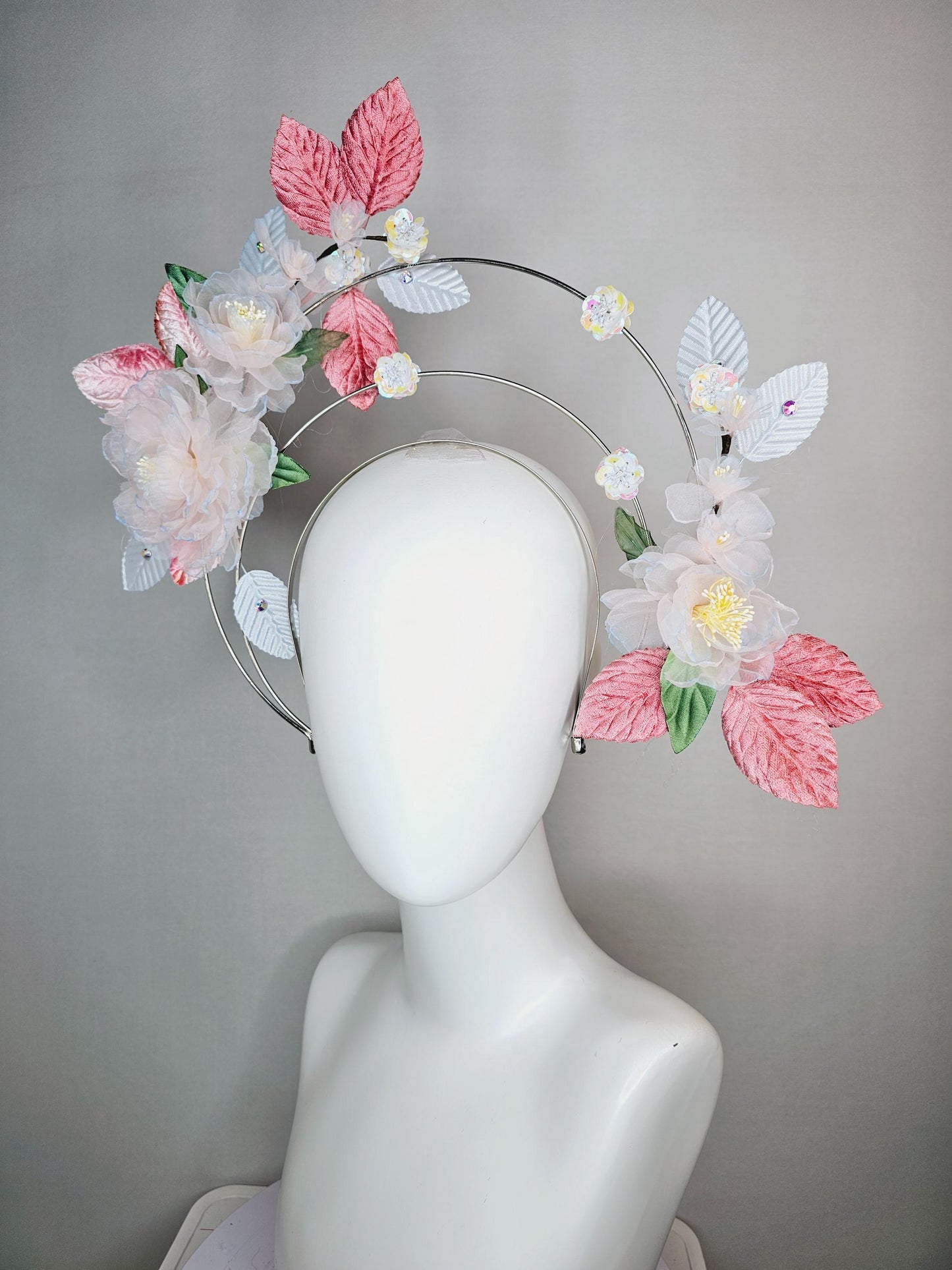 kentucky derby hat fascinator light pink and blue organza flowers dusty pink green leaves on tiered silver metallic headband sequin flower