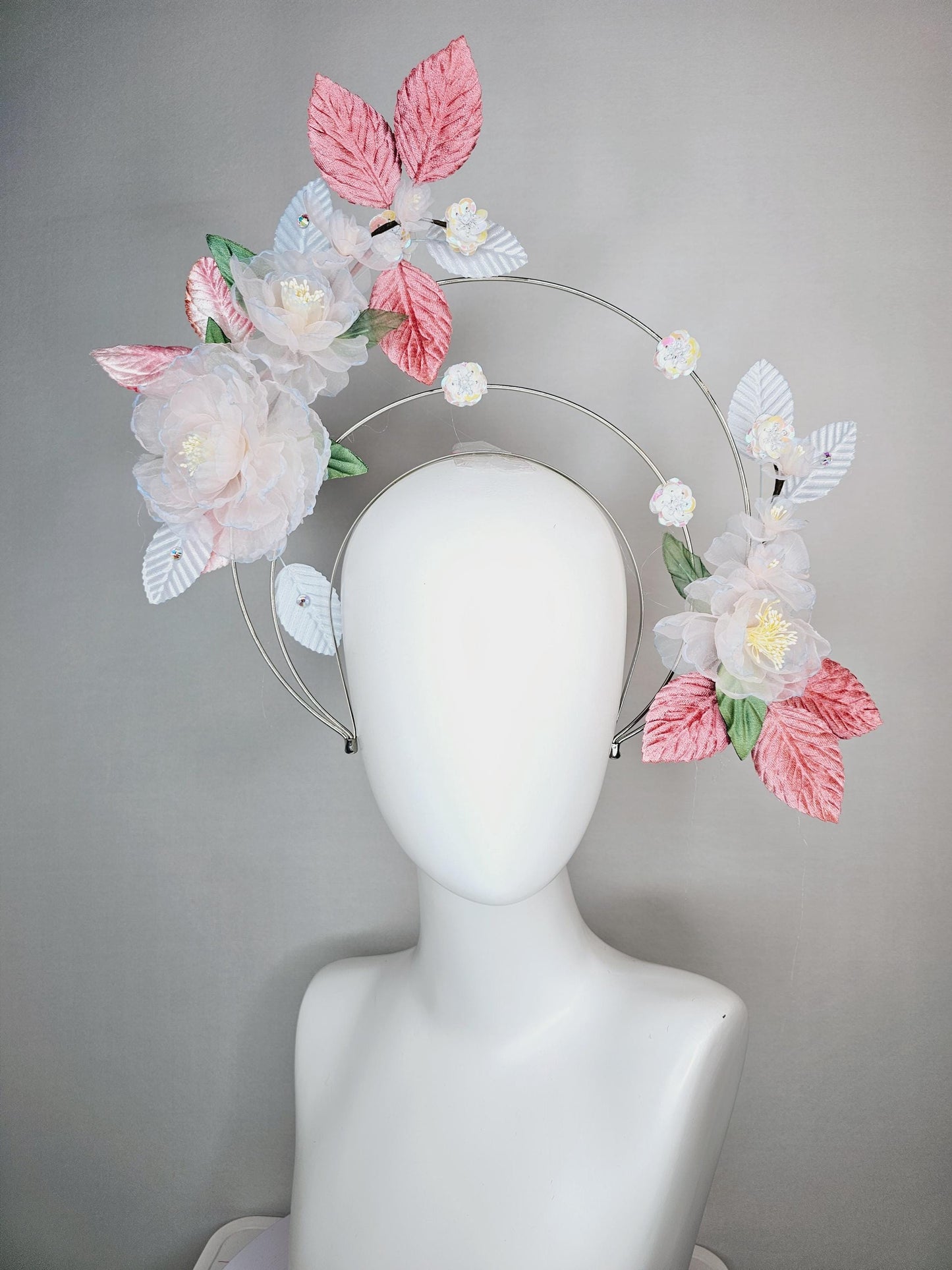 kentucky derby hat fascinator light pink and blue organza flowers dusty pink green leaves on tiered silver metallic headband sequin flower