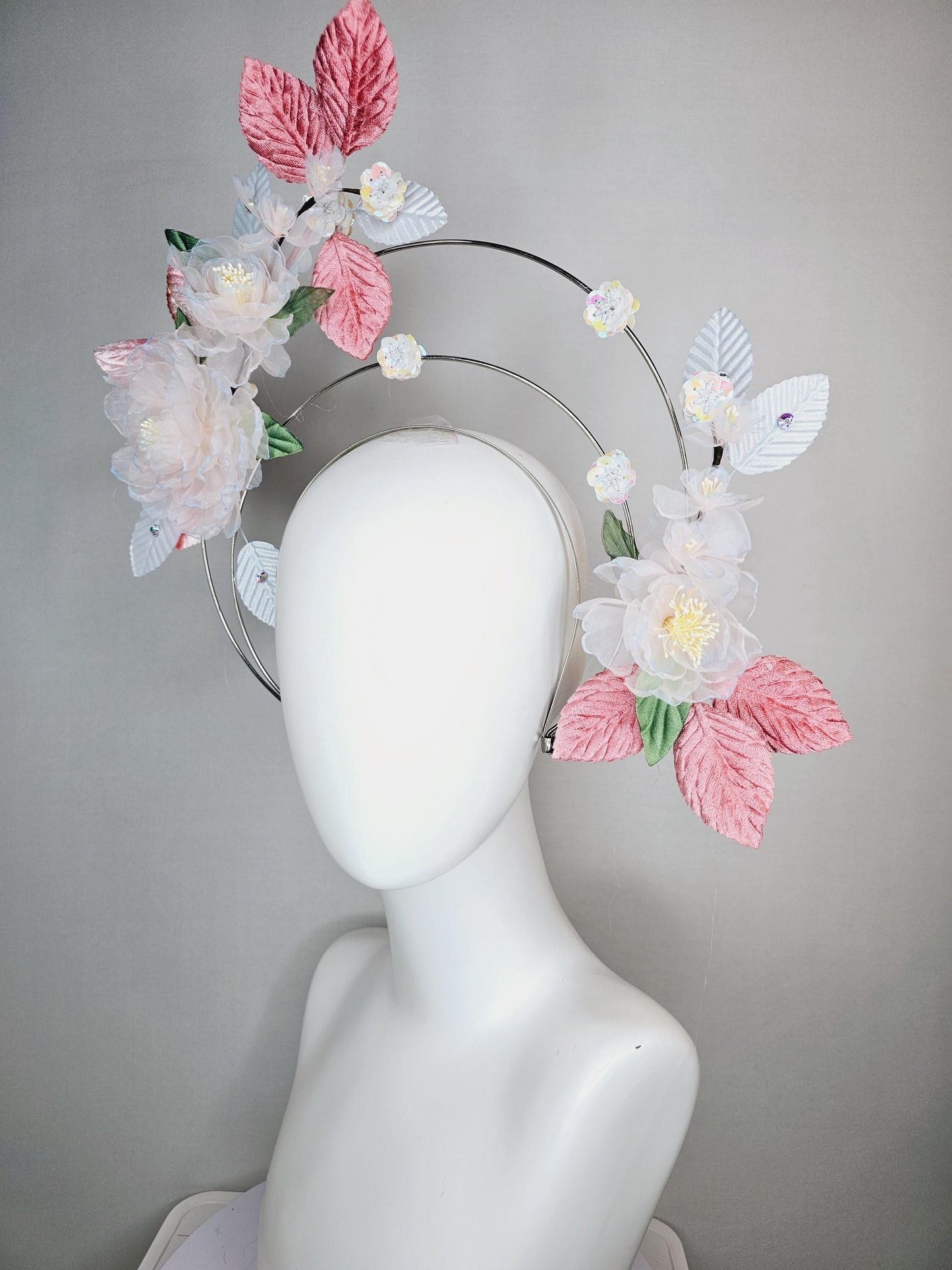 kentucky derby hat fascinator light pink and blue organza flowers dusty pink green leaves on tiered silver metallic headband sequin flower