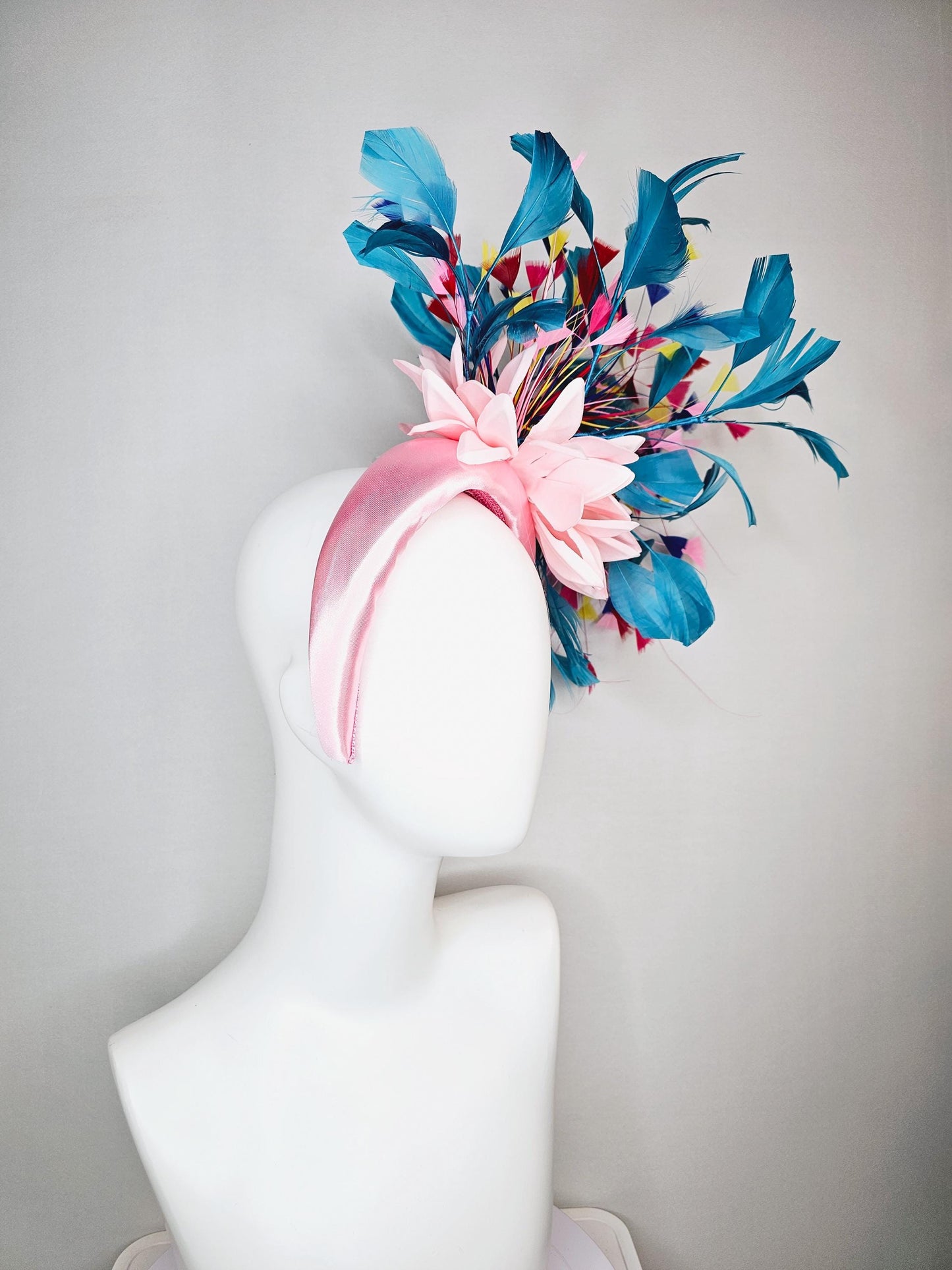kentucky derby hat fascinator light pink satin headband with satin flower colorful teal royal blue baby pink yellow red branching feathers