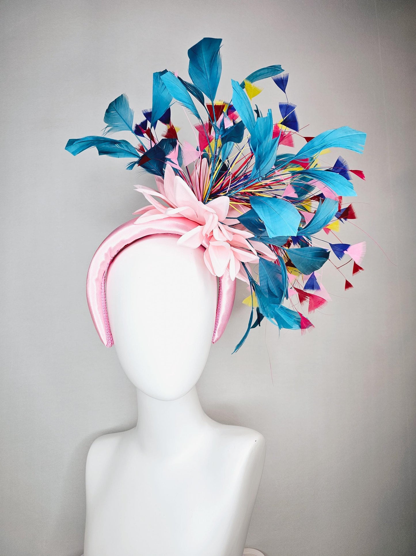 kentucky derby hat fascinator light pink satin headband with satin flower colorful teal royal blue baby pink yellow red branching feathers