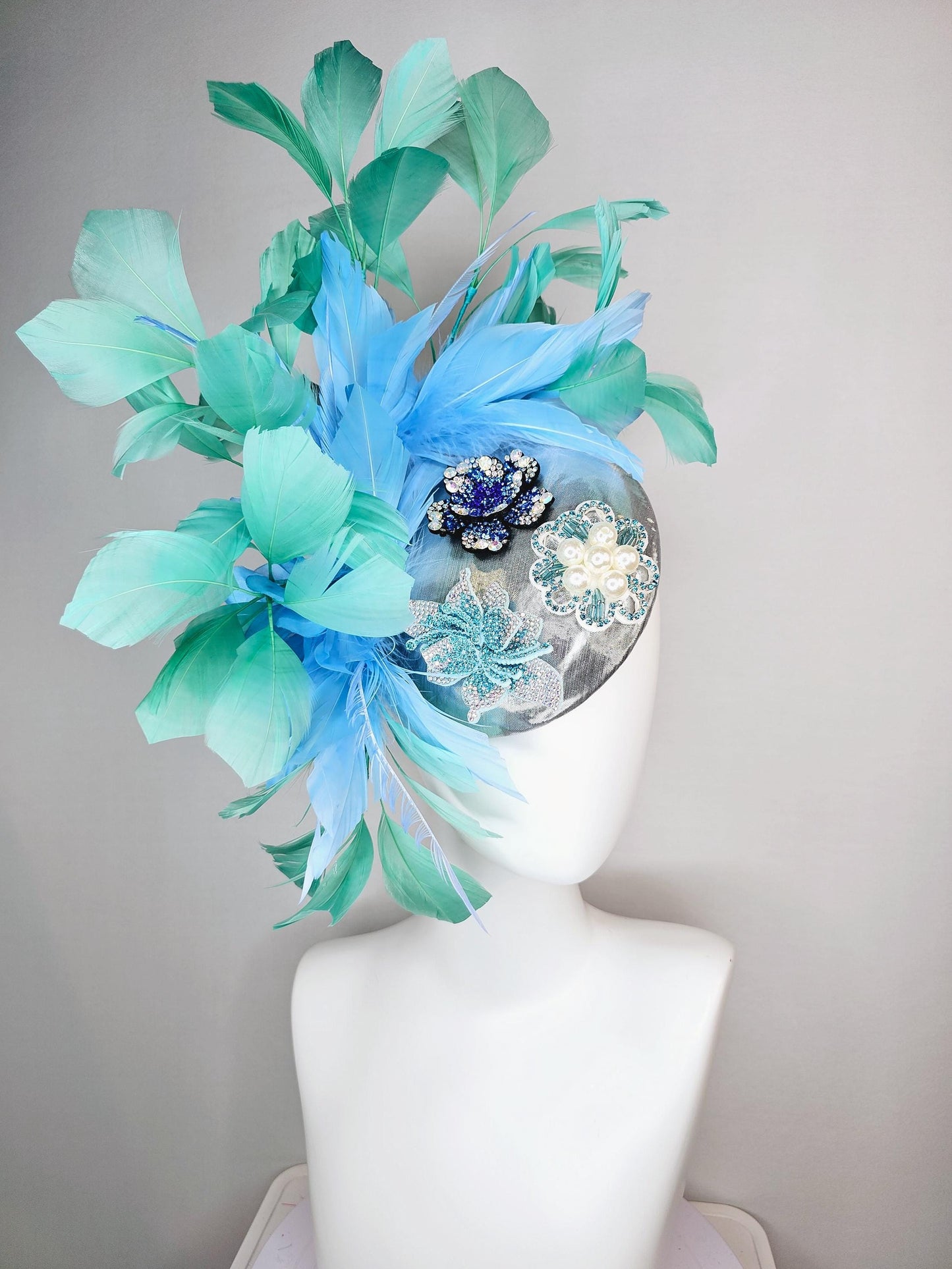 kentucky derby hat fascinator silver metallic with light royal cobalt blue iridescent crystal and pearl flowers mint green sky blue feathers