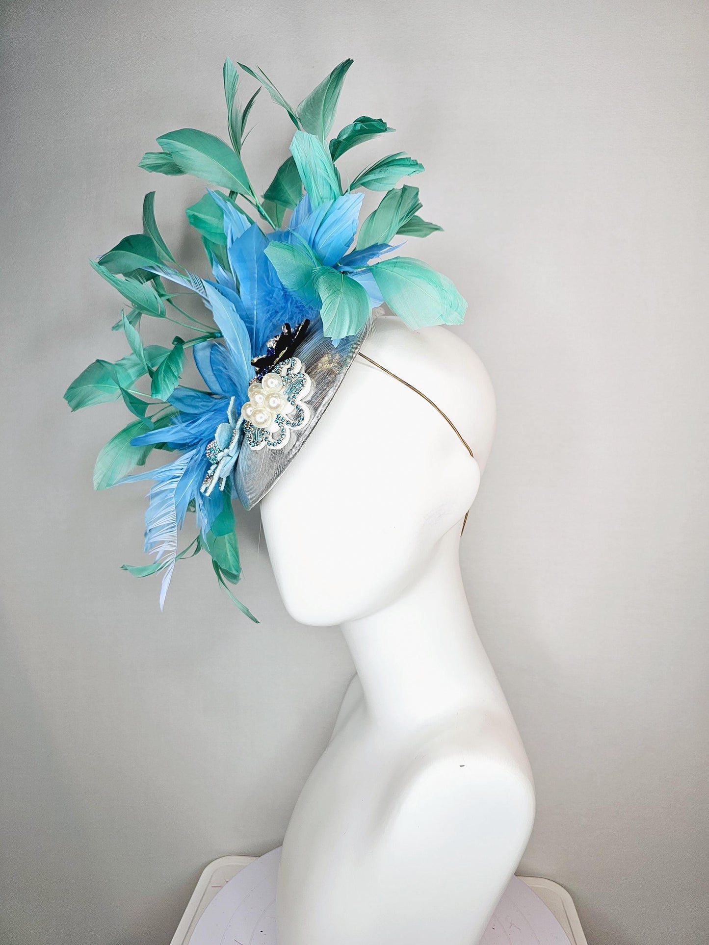 kentucky derby hat fascinator silver metallic with light royal cobalt blue iridescent crystal and pearl flowers mint green sky blue feathers