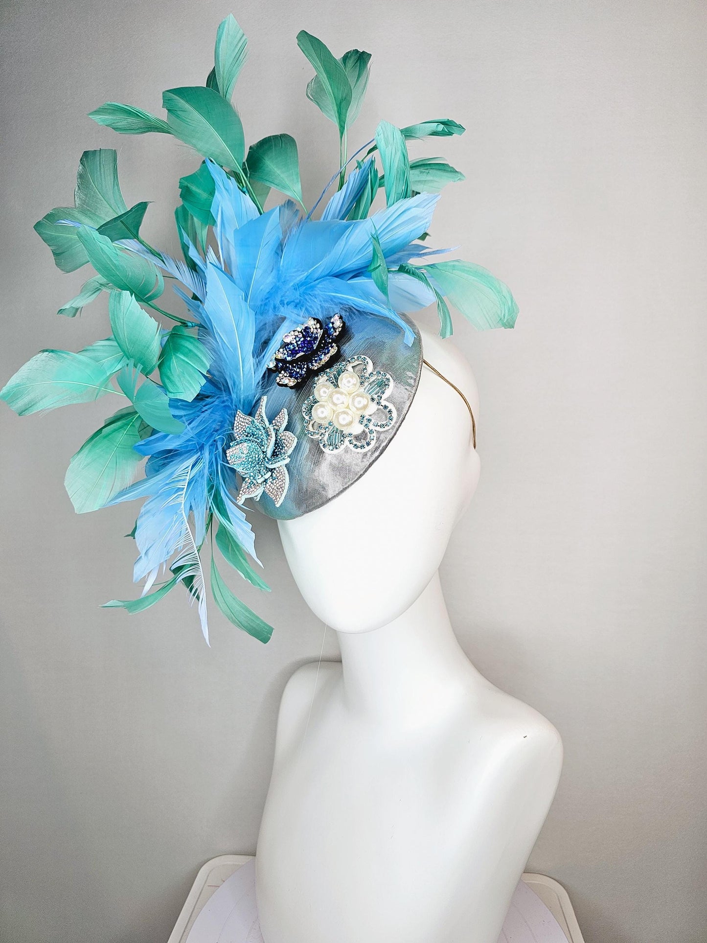 kentucky derby hat fascinator silver metallic with light royal cobalt blue iridescent crystal and pearl flowers mint green sky blue feathers