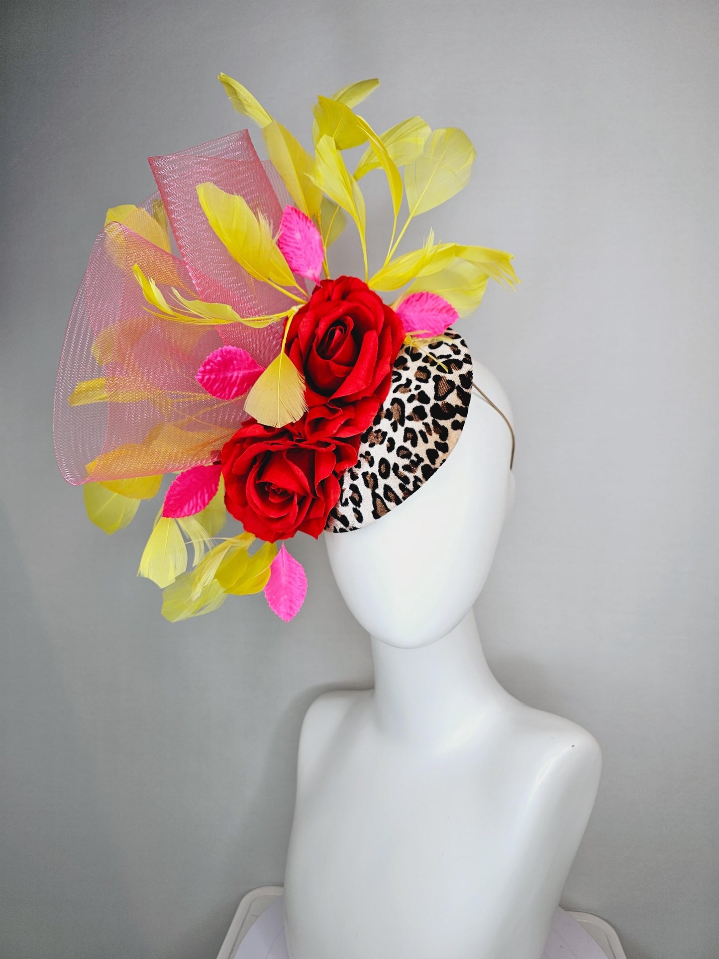kentucky derby hat fascinator velvet leopard print base with red satin roses pink crinoline ruffle pink leaves and yellow branching feathers