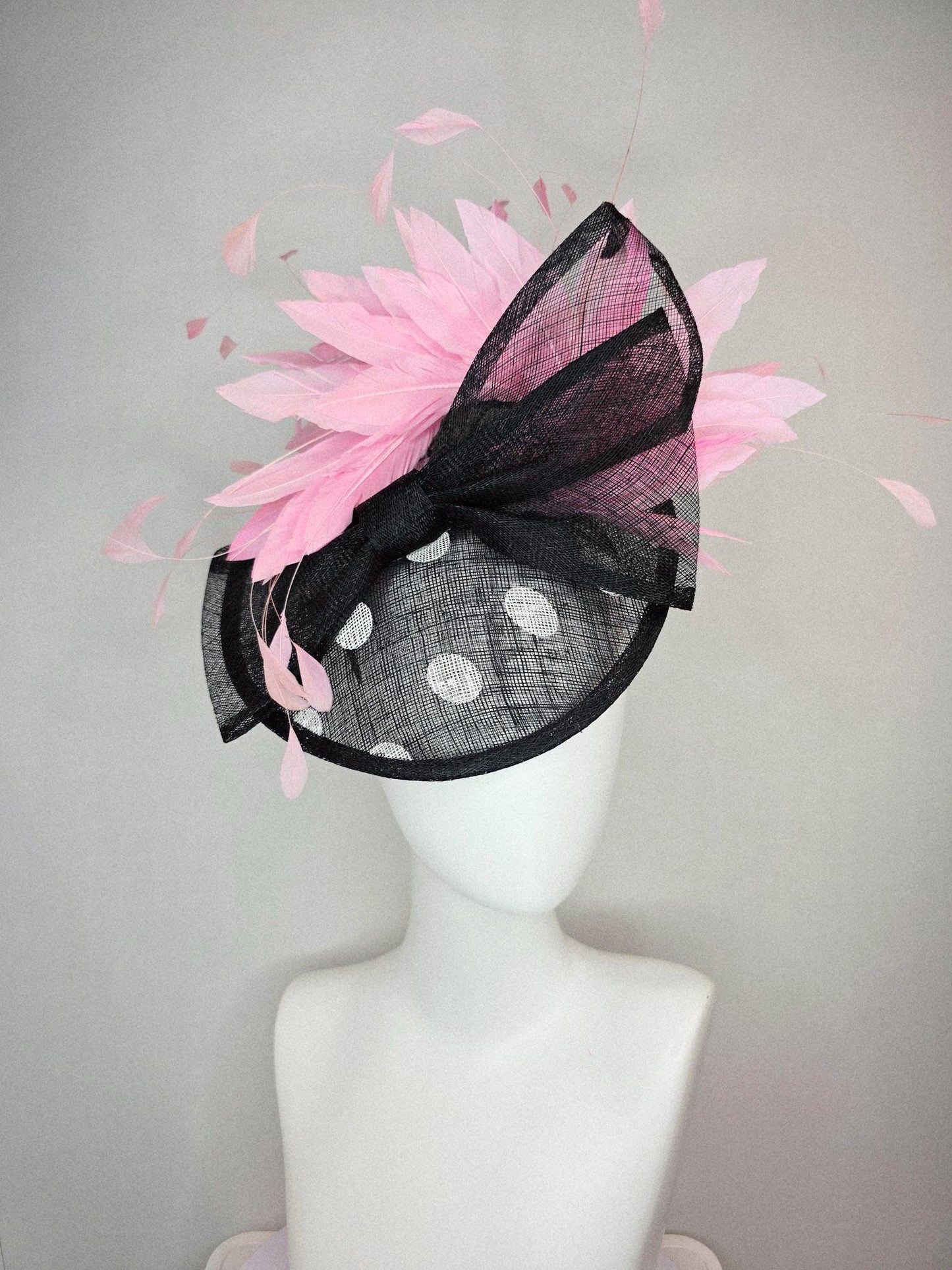 kentucky derby hat fascinator black and white polka dot sinamay saucer with black sinamay bow and light baby pink branching feathers