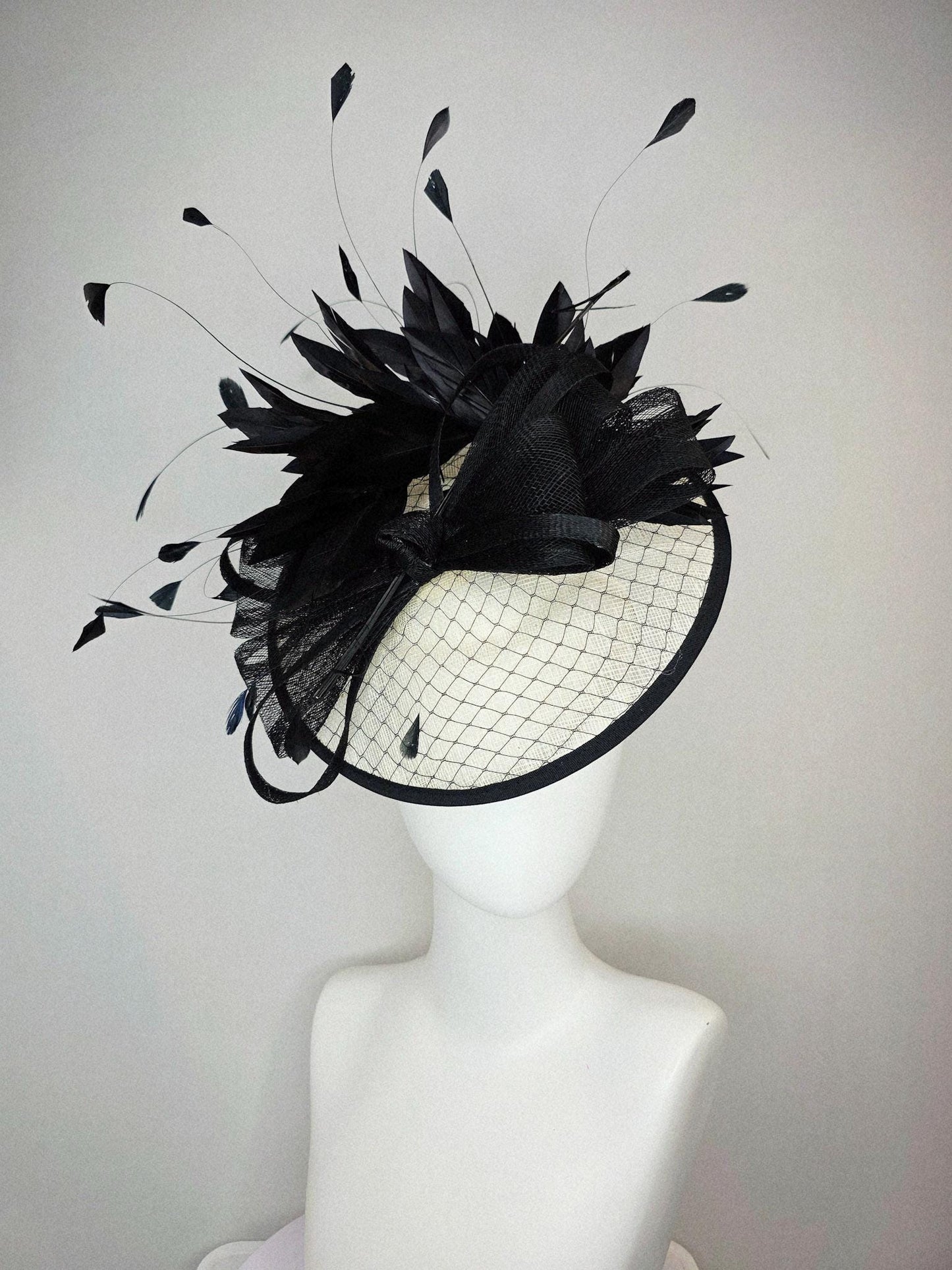 kentucky derby hat fascinator ivory white sinamay saucer with black netting and black sinamay trim and bow and black branching feathers