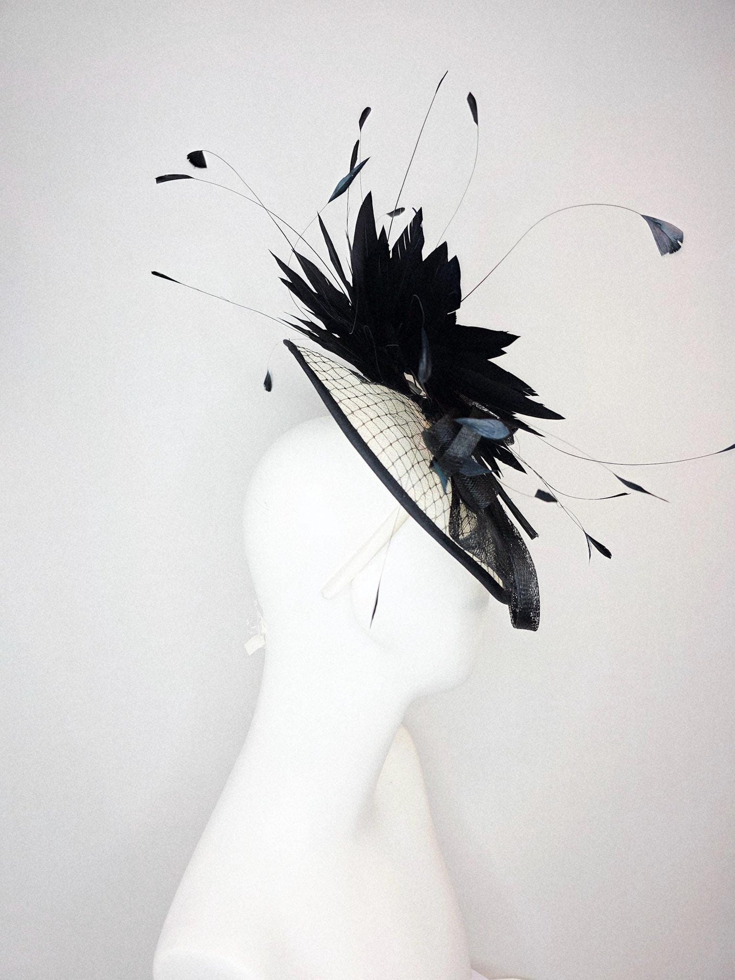 kentucky derby hat fascinator ivory white sinamay saucer with black netting and black sinamay trim and bow and black branching feathers