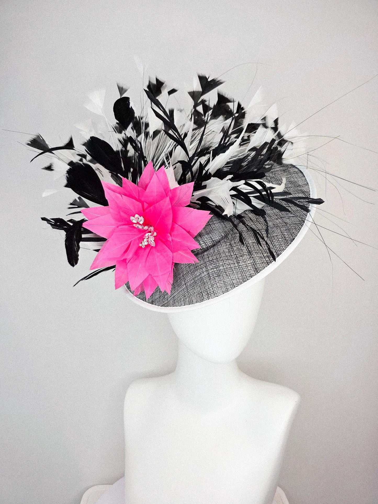kentucky derby hat fascinator black and white sinamay saucer with white sinamay trim pink feather flower black and white branching feathers