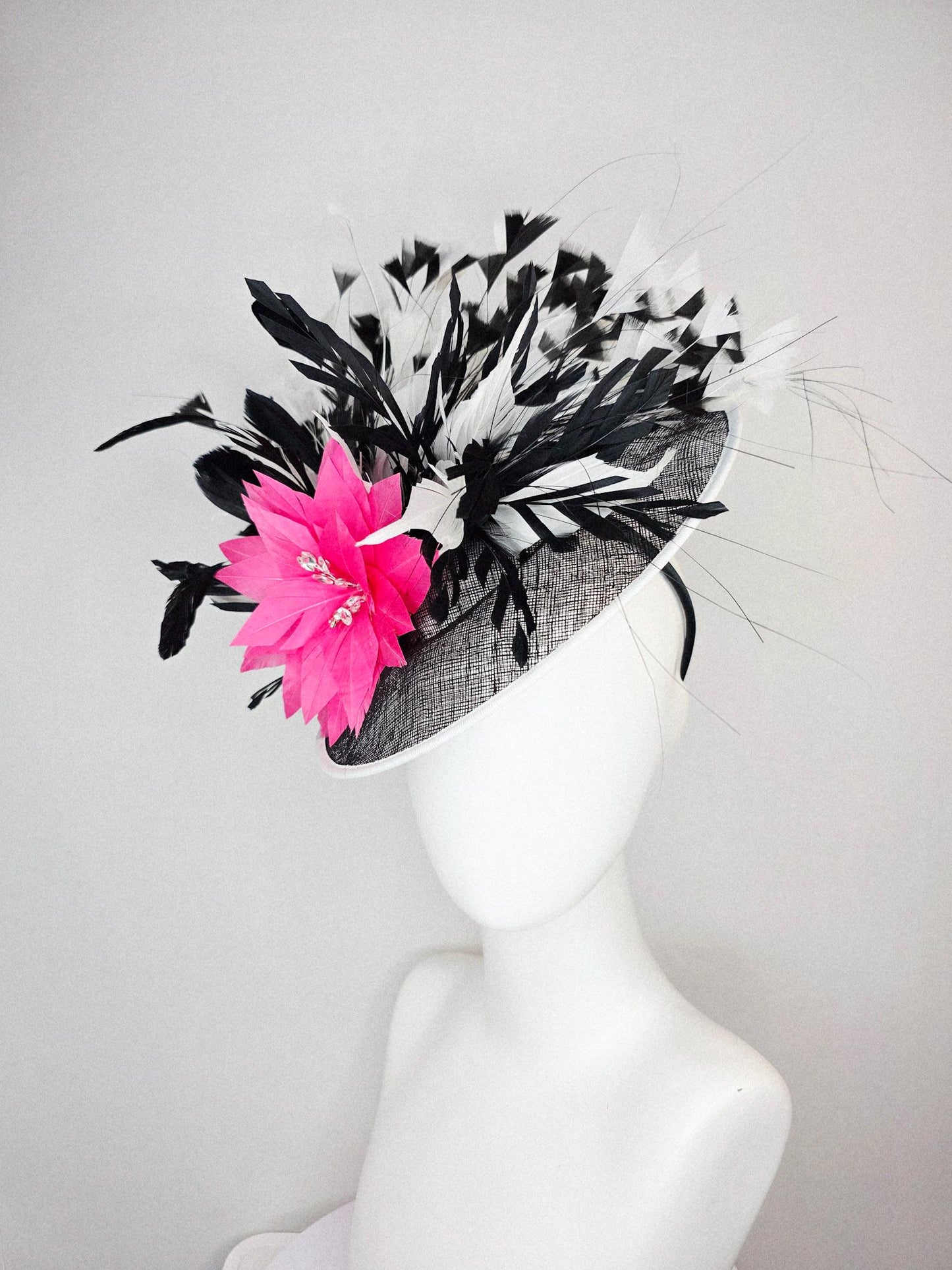 kentucky derby hat fascinator black and white sinamay saucer with white sinamay trim pink feather flower black and white branching feathers