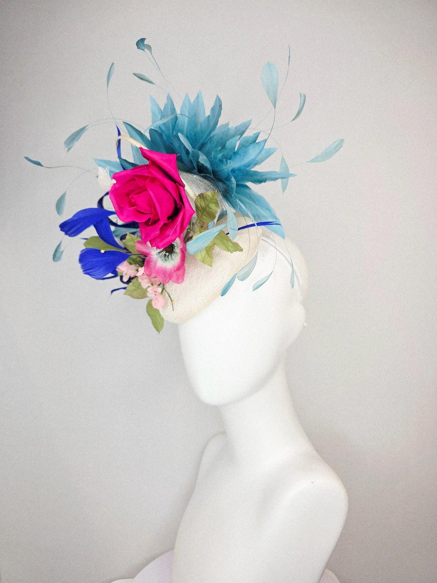 kentucky derby hat fascinator white sinamay with curls fuchsia satin rose and pink flowers light green leaves and cobalt teal blue feathers