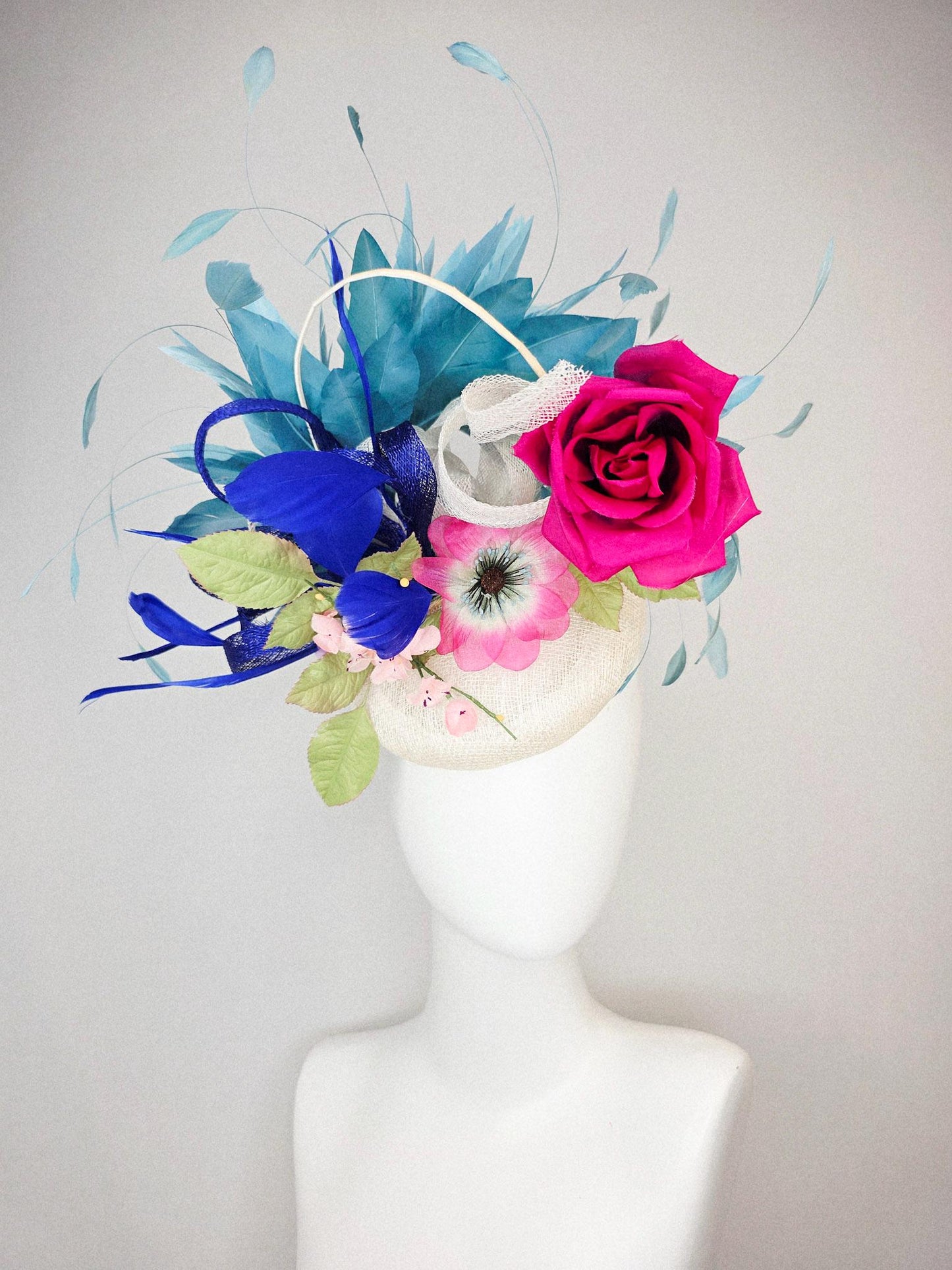 kentucky derby hat fascinator white sinamay with curls fuchsia satin rose and pink flowers light green leaves and cobalt teal blue feathers