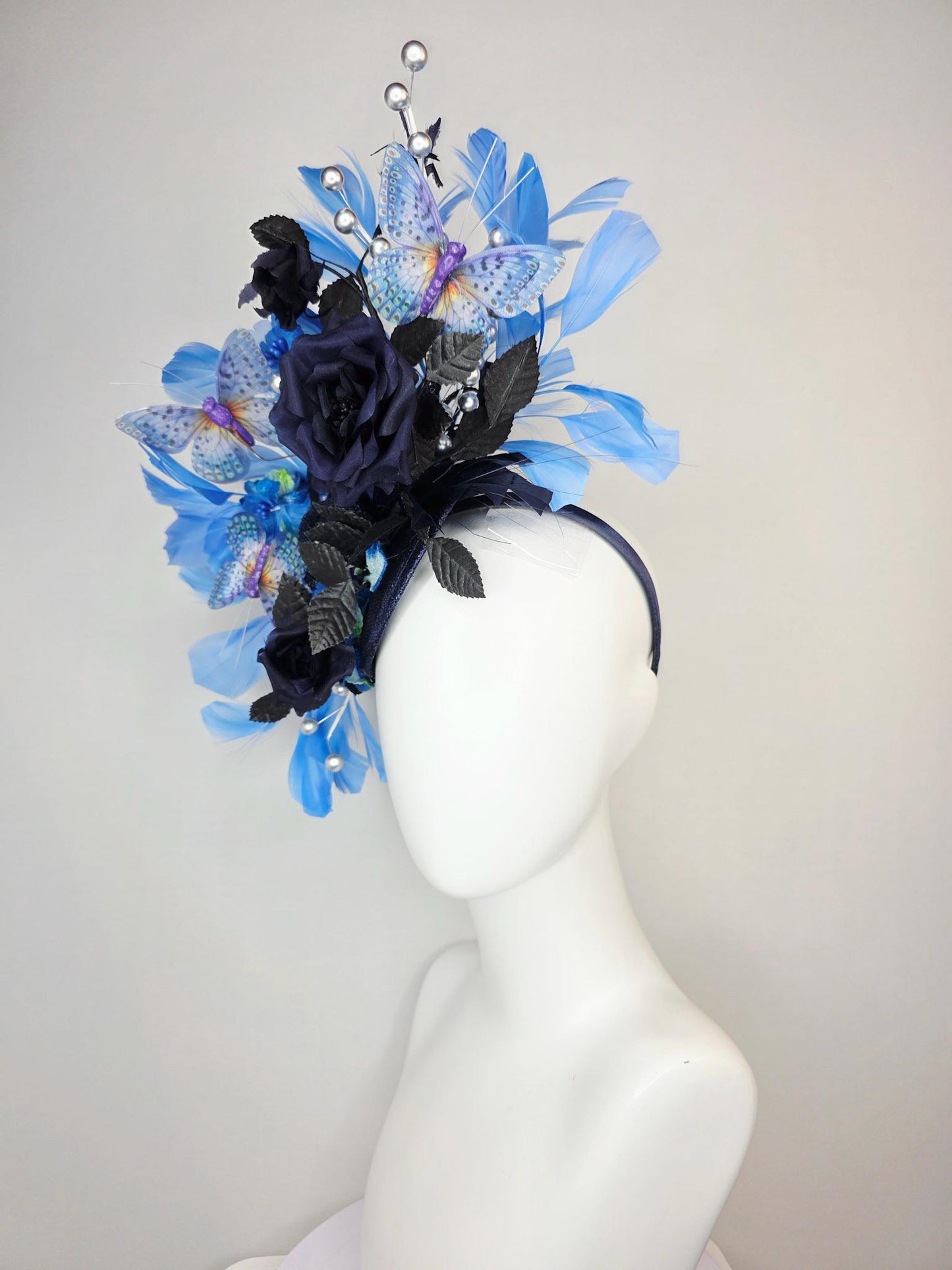 kentucky derby hat fascinator navy blue satin roses black leaves royal blue sky blue feathers silver pearls lavender purple blue butterflies