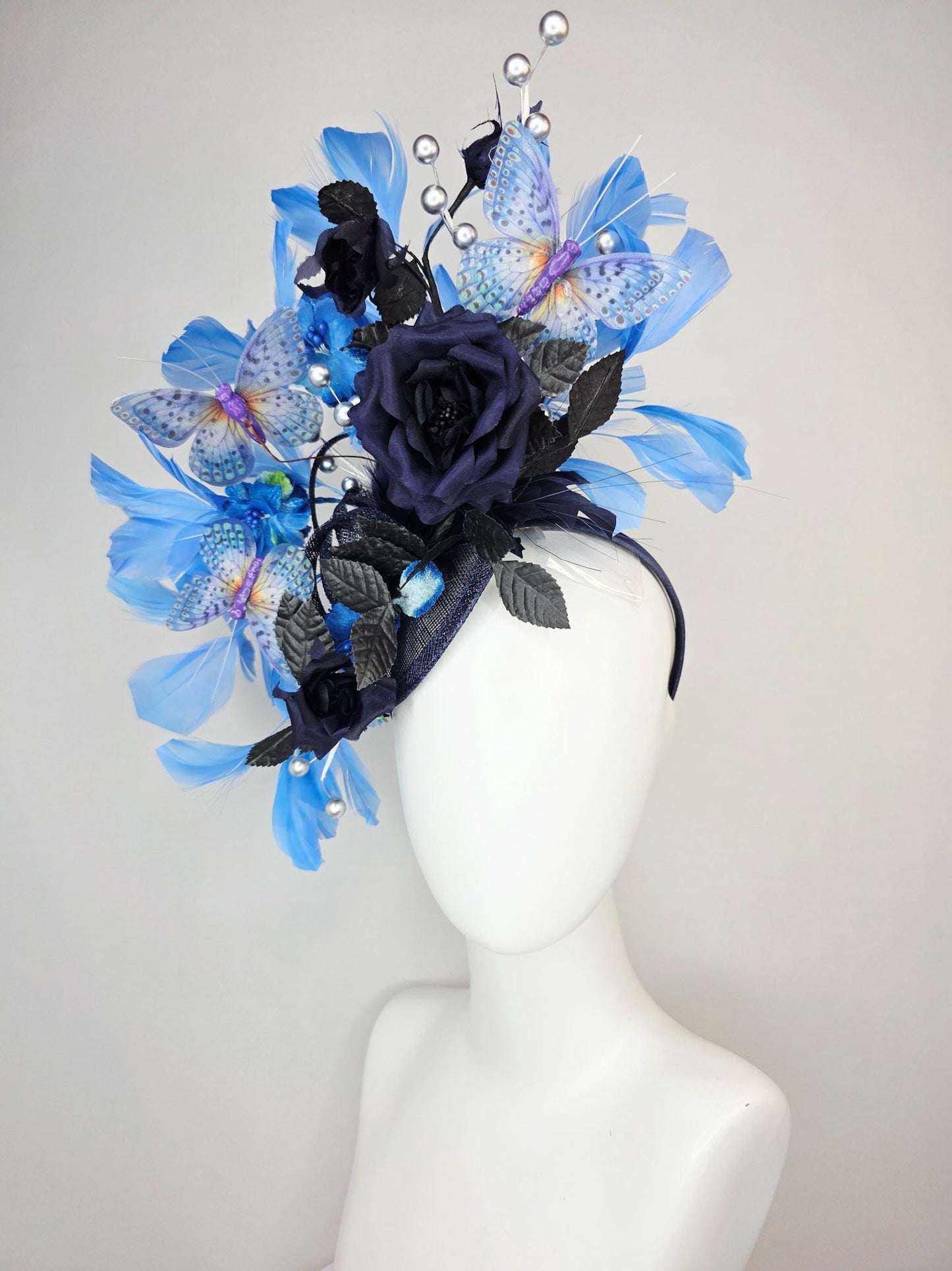 kentucky derby hat fascinator navy blue satin roses black leaves royal blue sky blue feathers silver pearls lavender purple blue butterflies