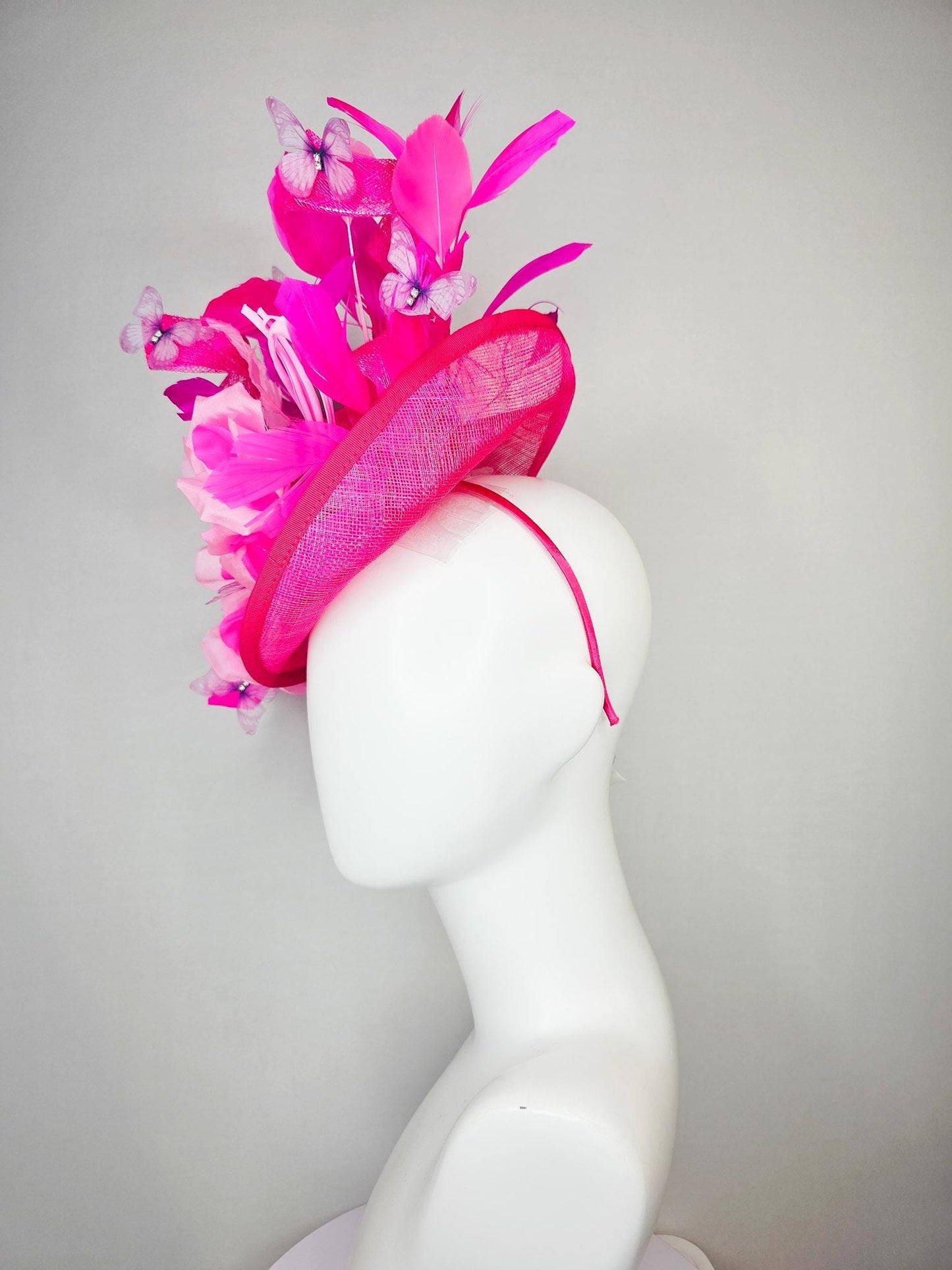 kentucky derby hat fascinator hot pink sinamay saucer blush pink satin flowers light pink leaves bright pink fuchsia feathers butterflies